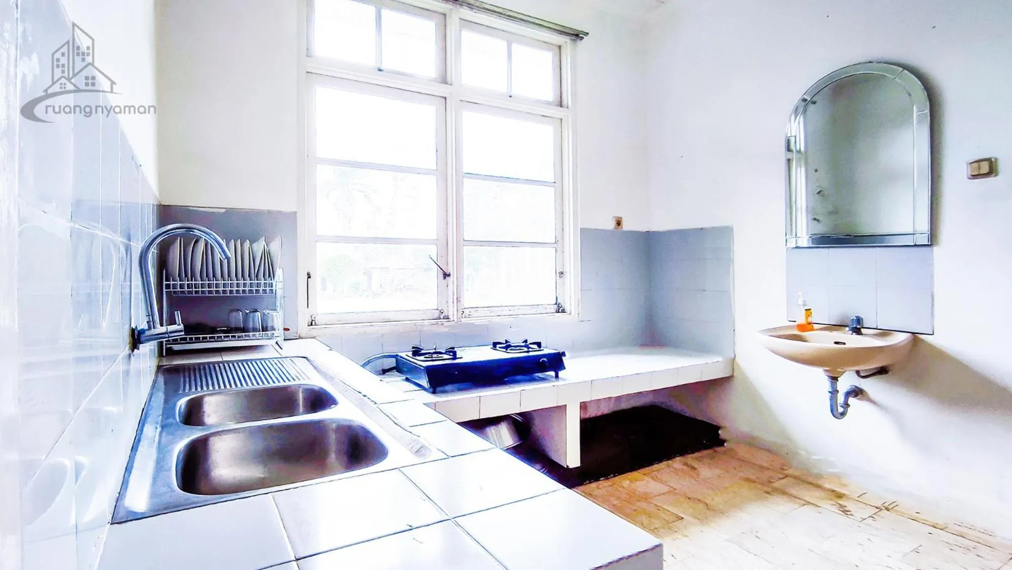 Kitchen or kitchenette in Sukanagalih Resort by Ruang Nyaman