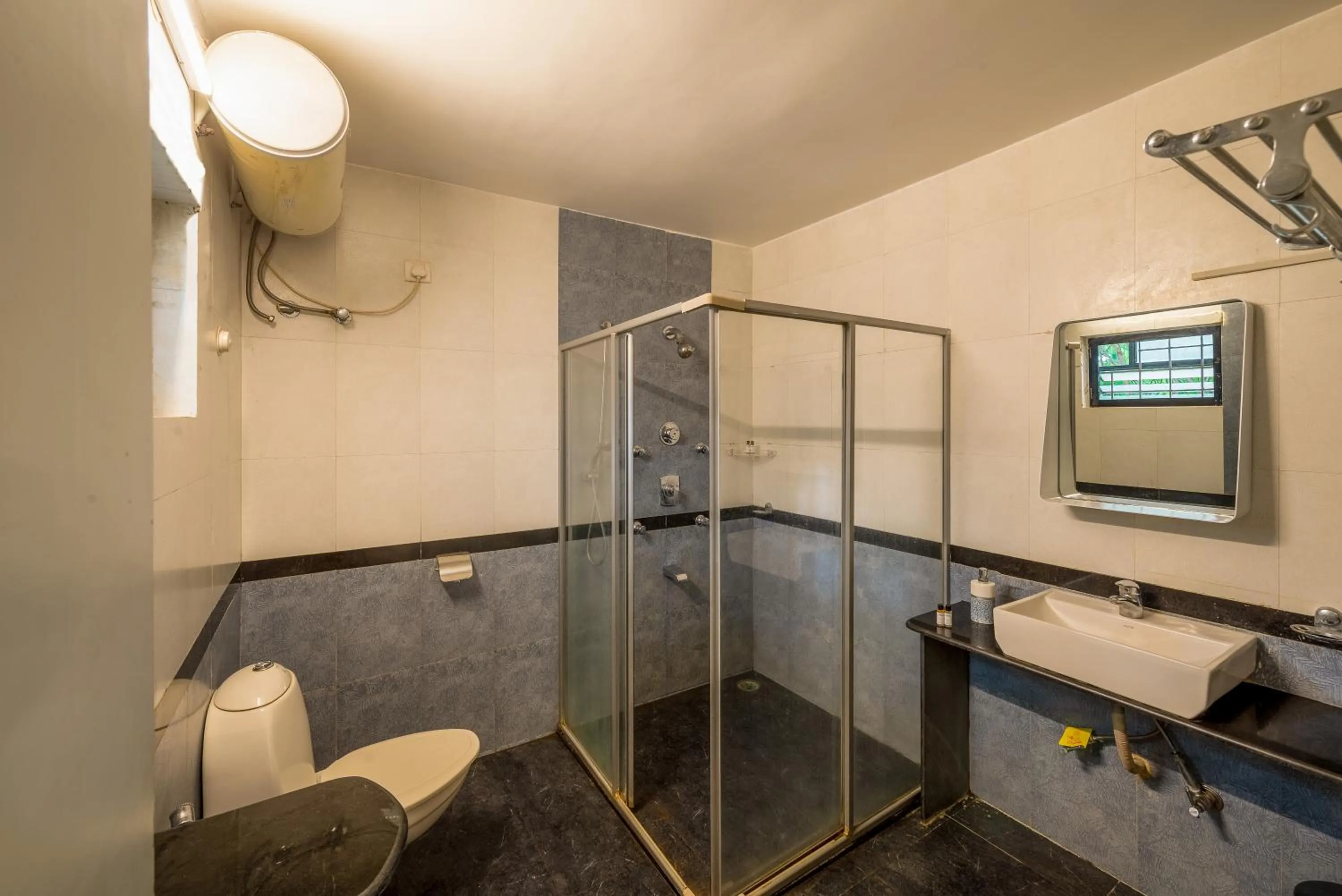 Toilet in Olive Hotel Calangute Niwasa by Embassy Group