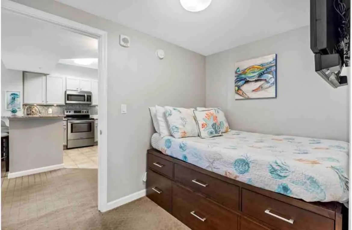 Bed in Pink Sunsets at the Palms of Destin Across from Beach, Heated Pool Shuttle & Dining