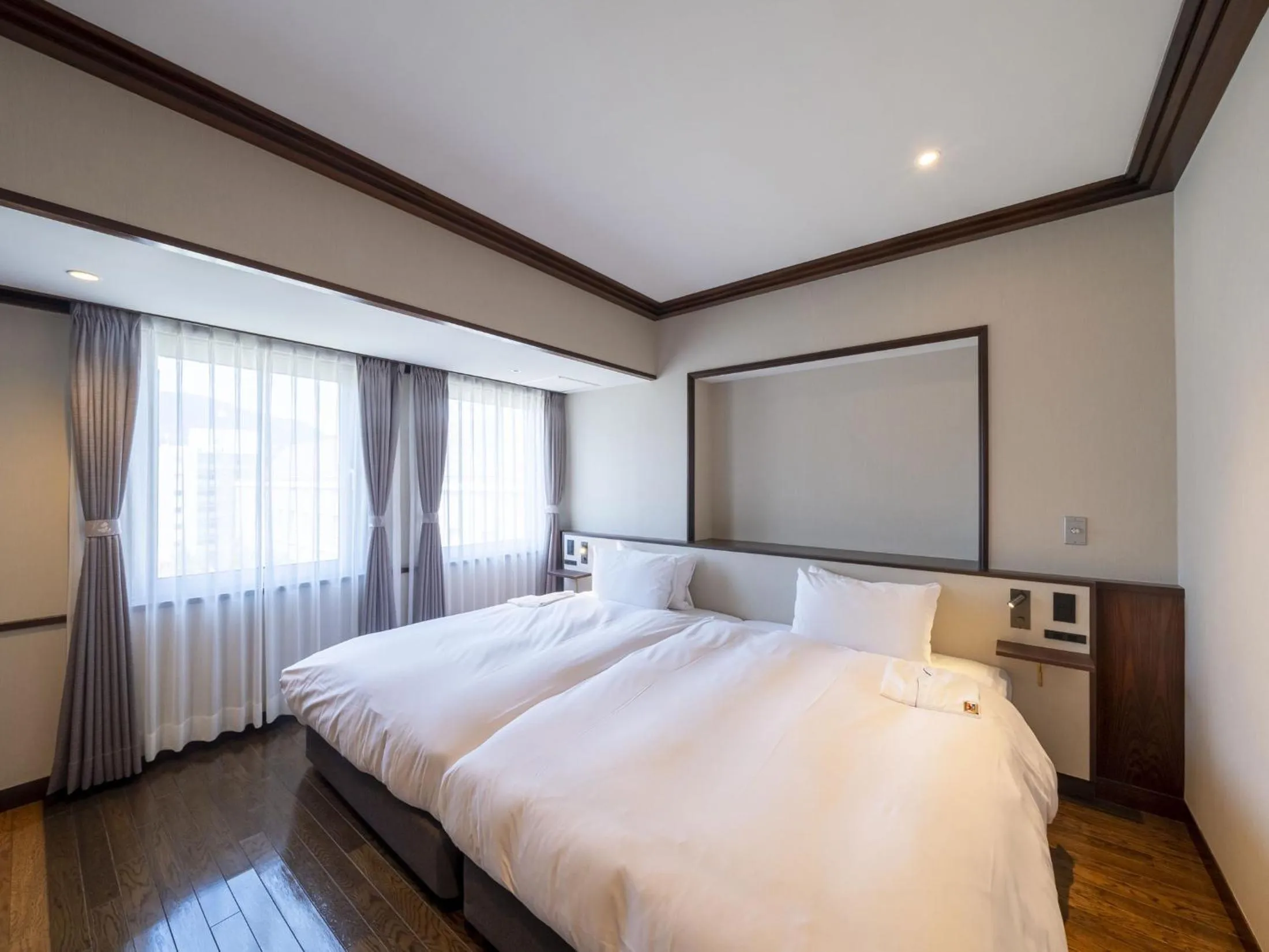 Bed in The Saihokukan Hotel
