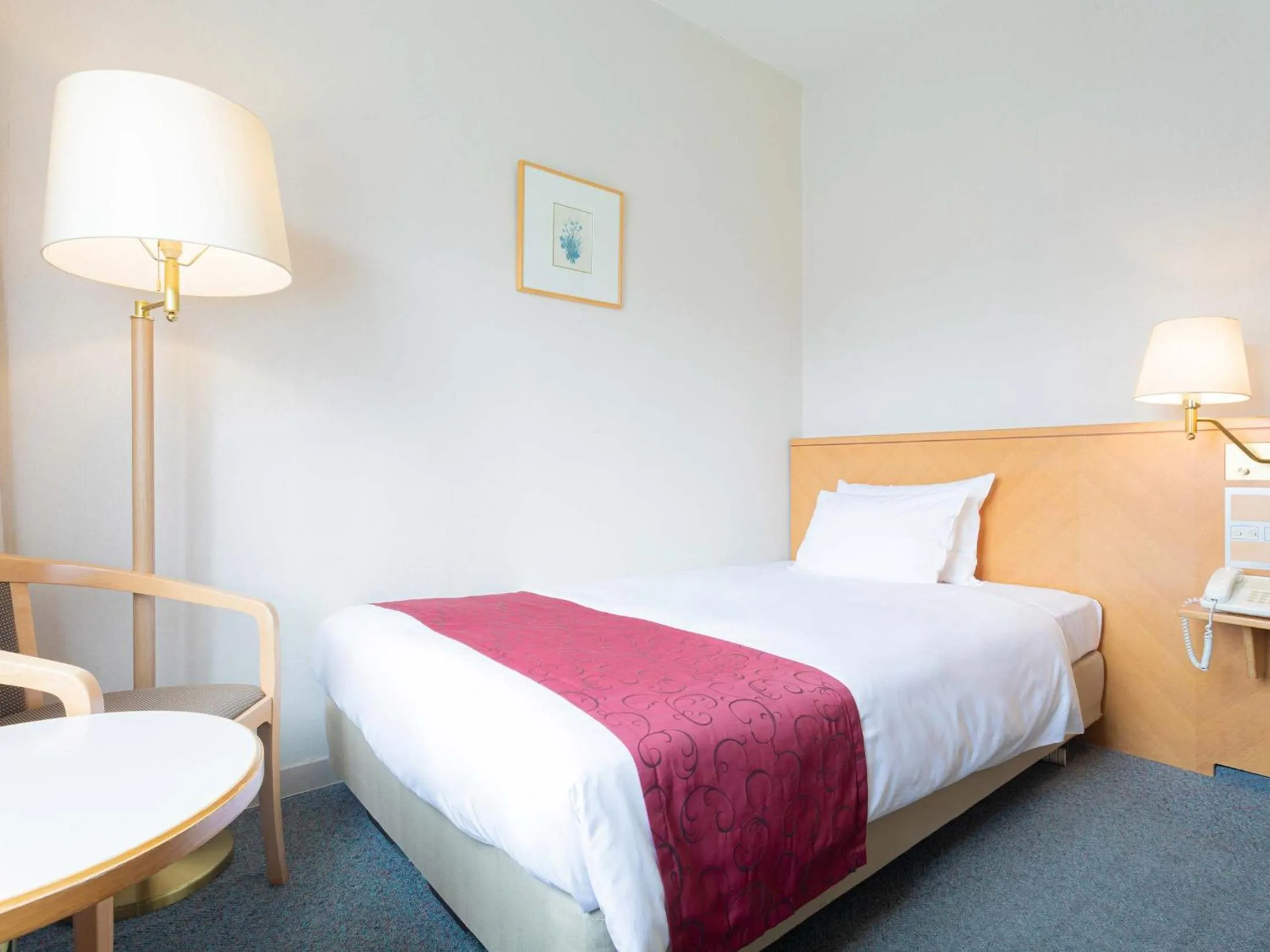 Bed in The Saihokukan Hotel