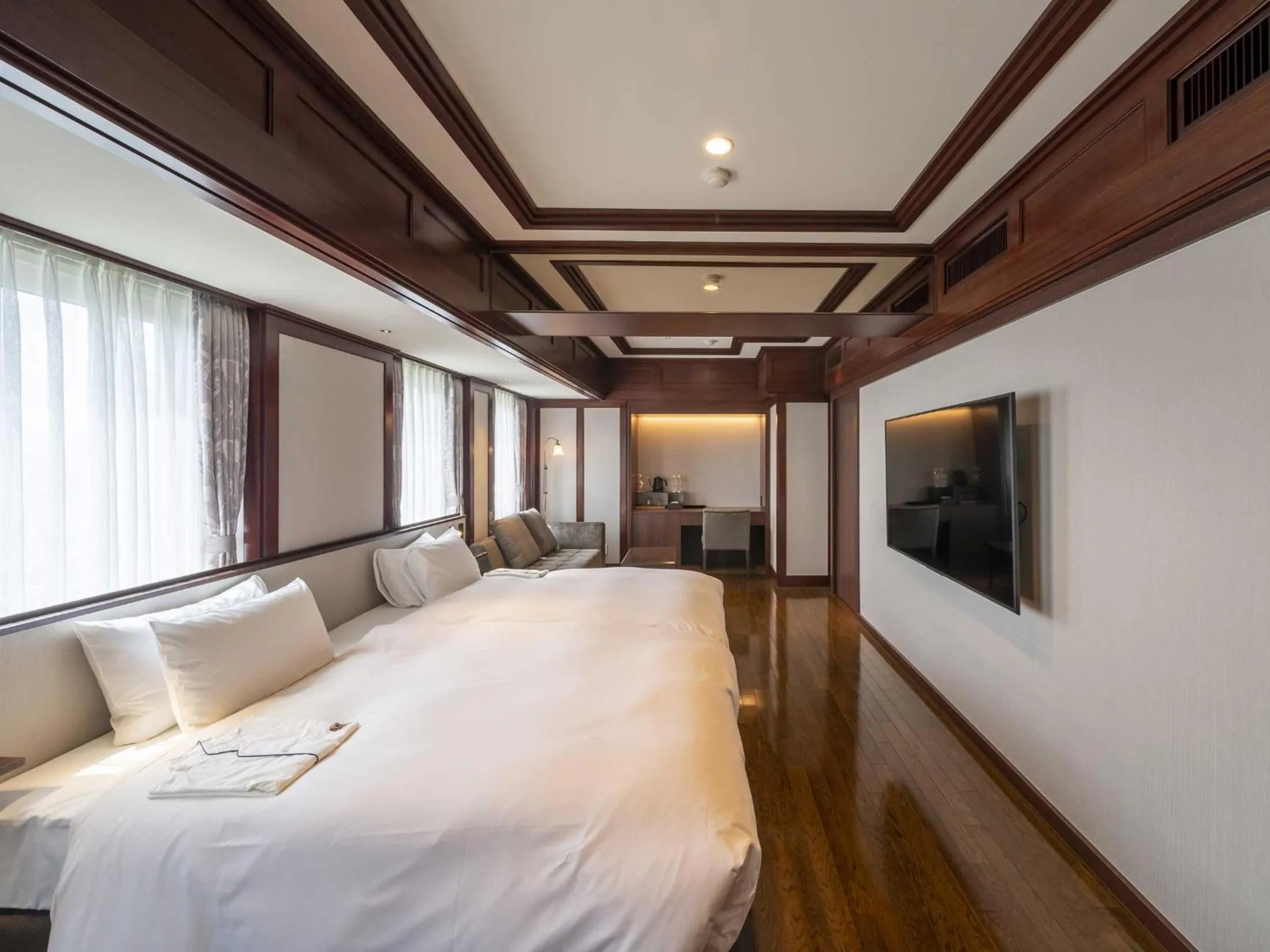 Bed in The Saihokukan Hotel