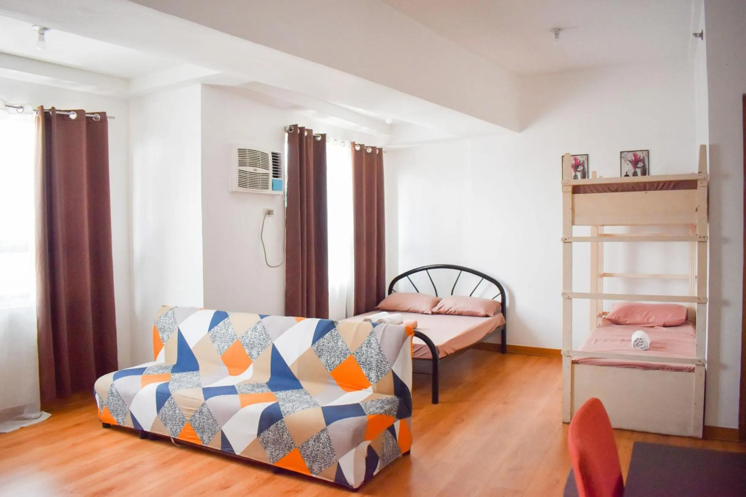 Photo of the whole room, Bed in The Boni Tower by RSPL Manila City Center