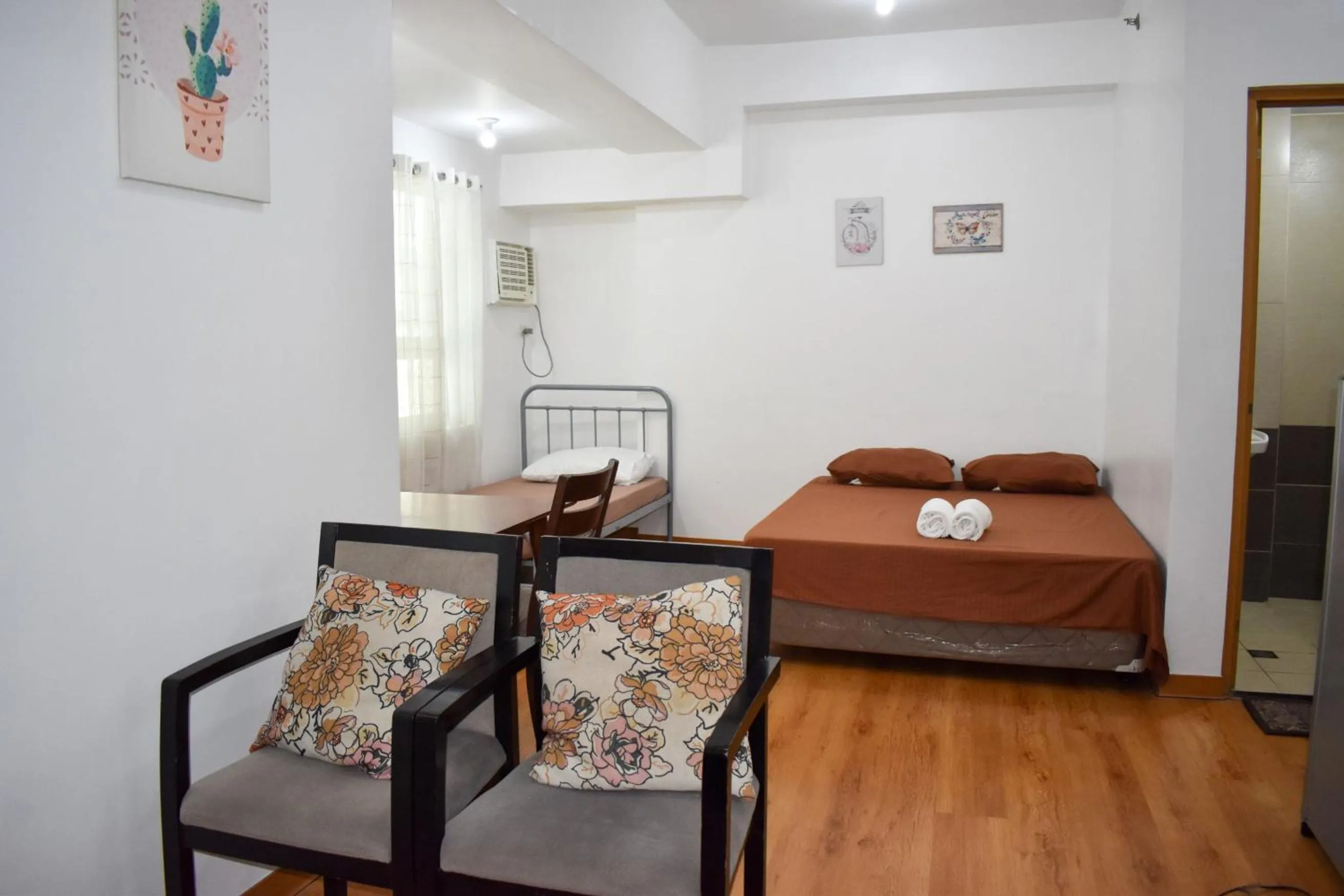 Living room, Bed in The Boni Tower by RSPL Manila City Center