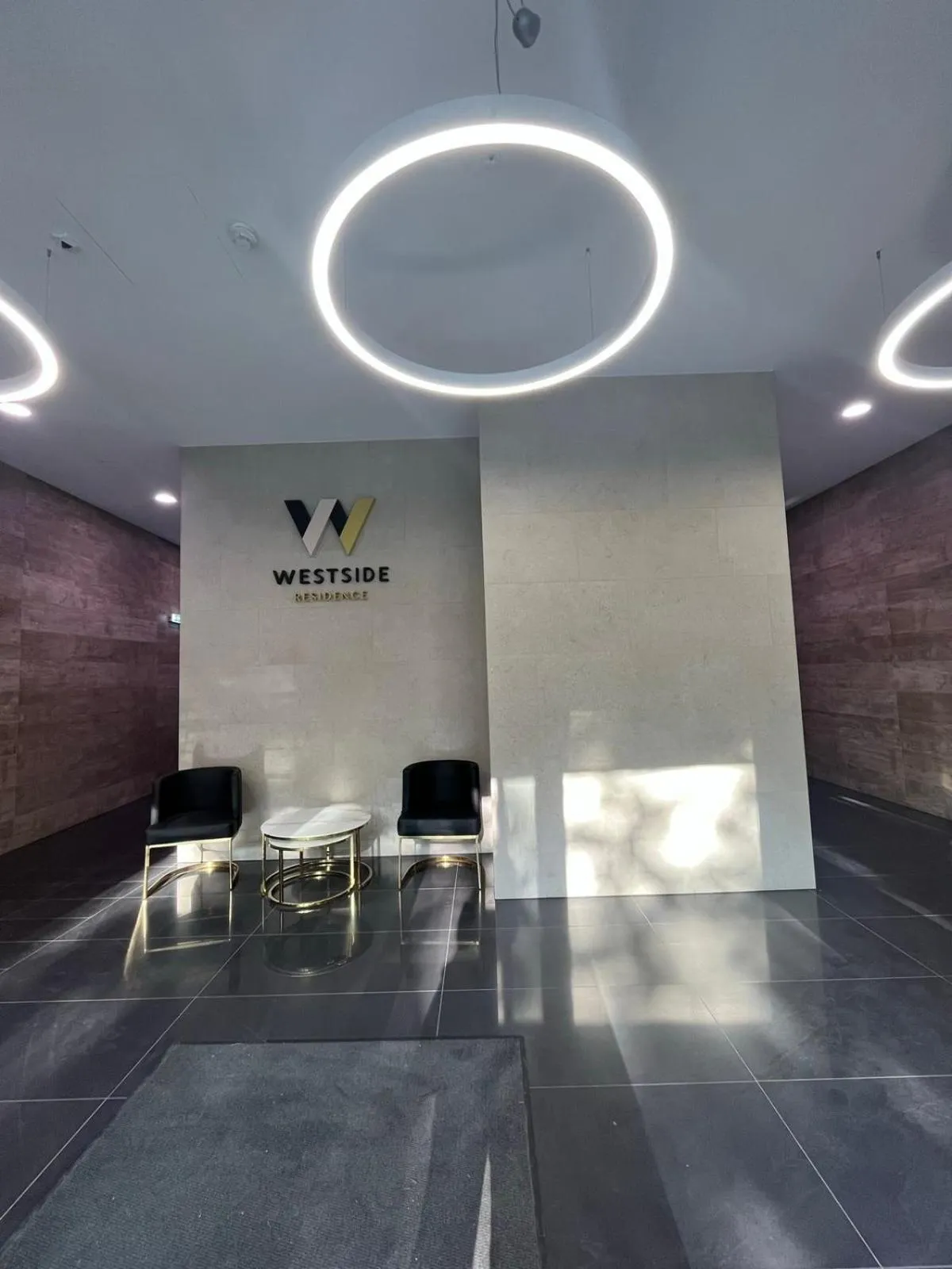 Property logo or sign in WestSide Apartments by FirstHost