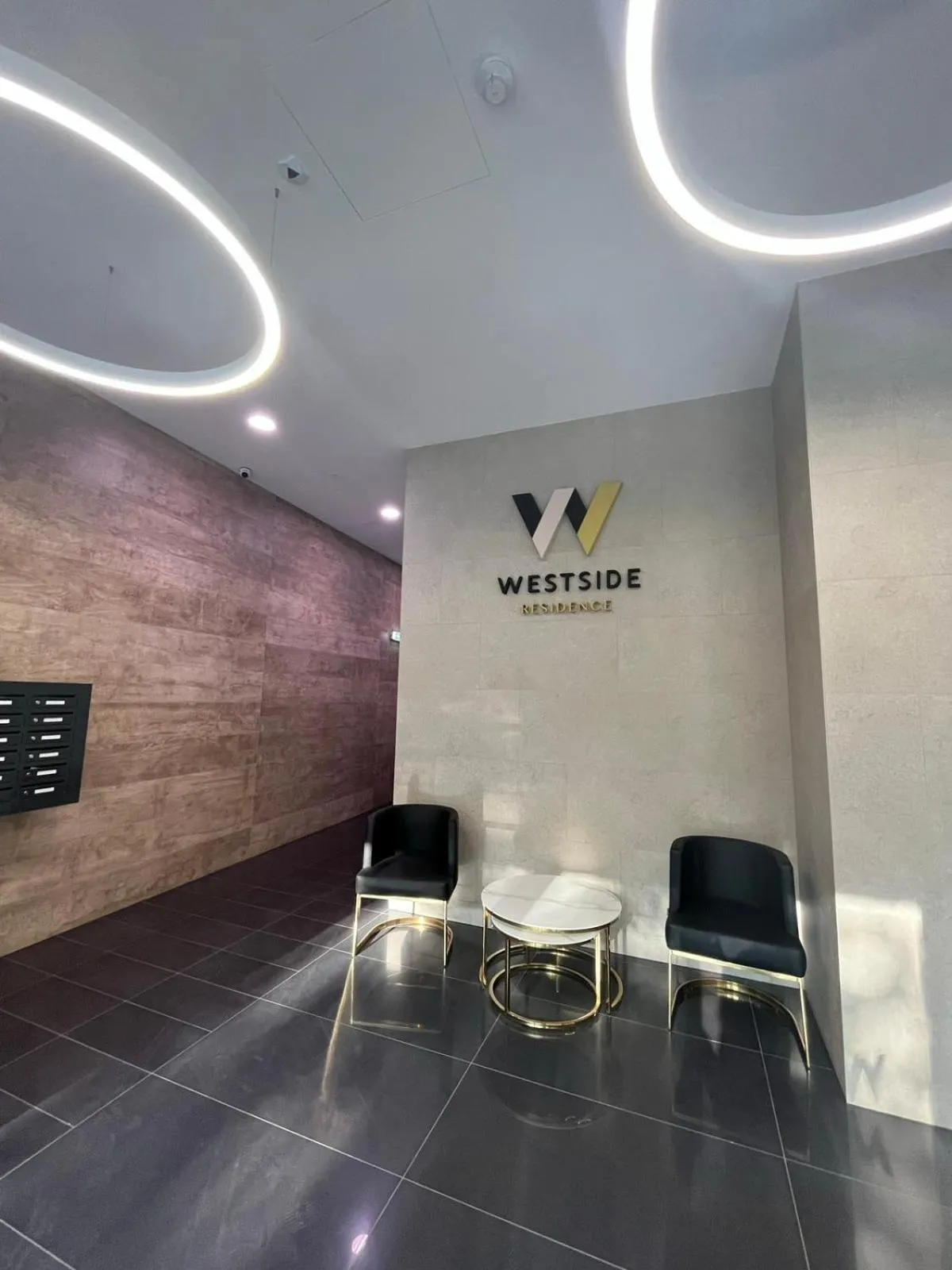 Property logo or sign in WestSide Apartments by FirstHost