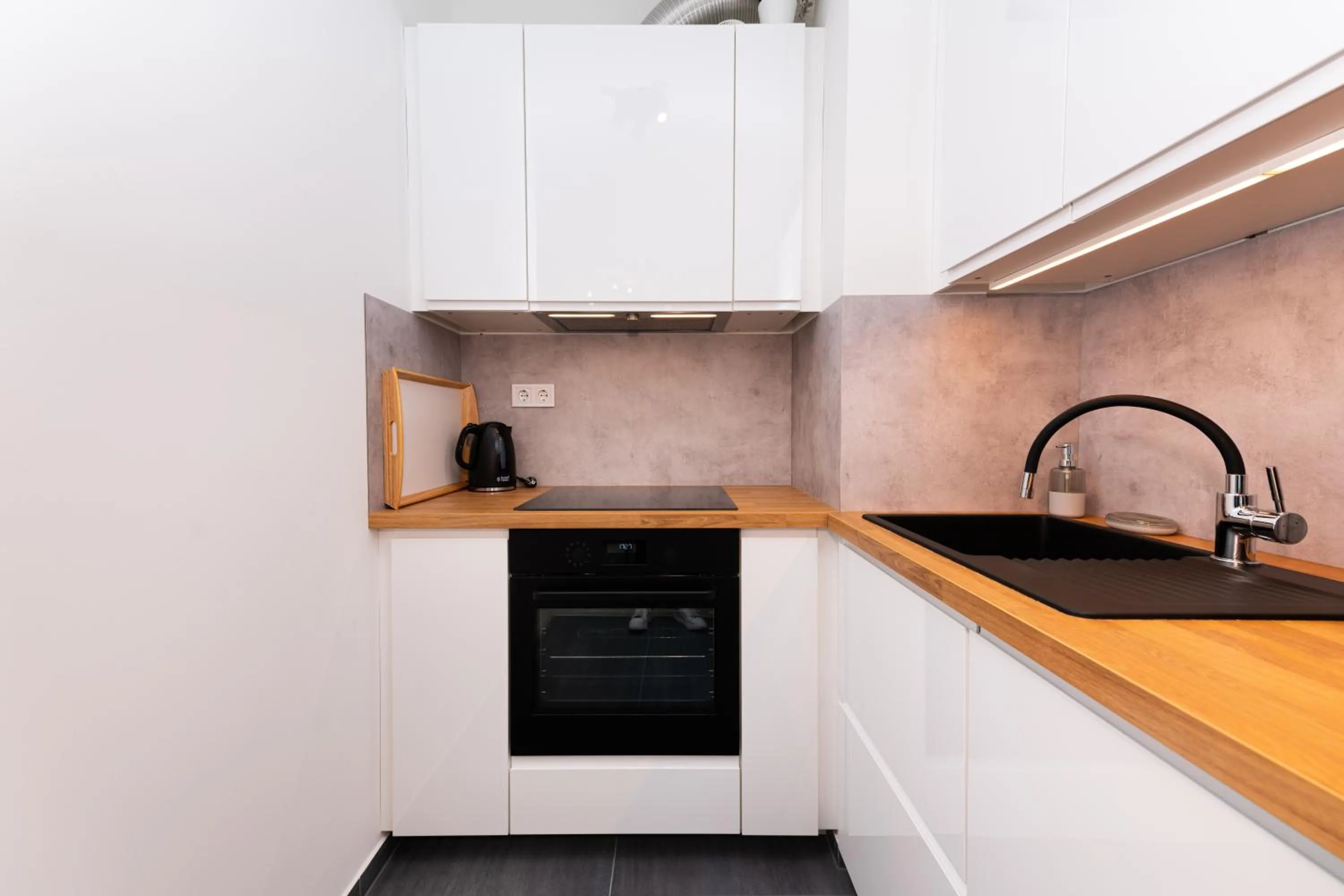 Kitchen or kitchenette in WestSide Apartments by FirstHost