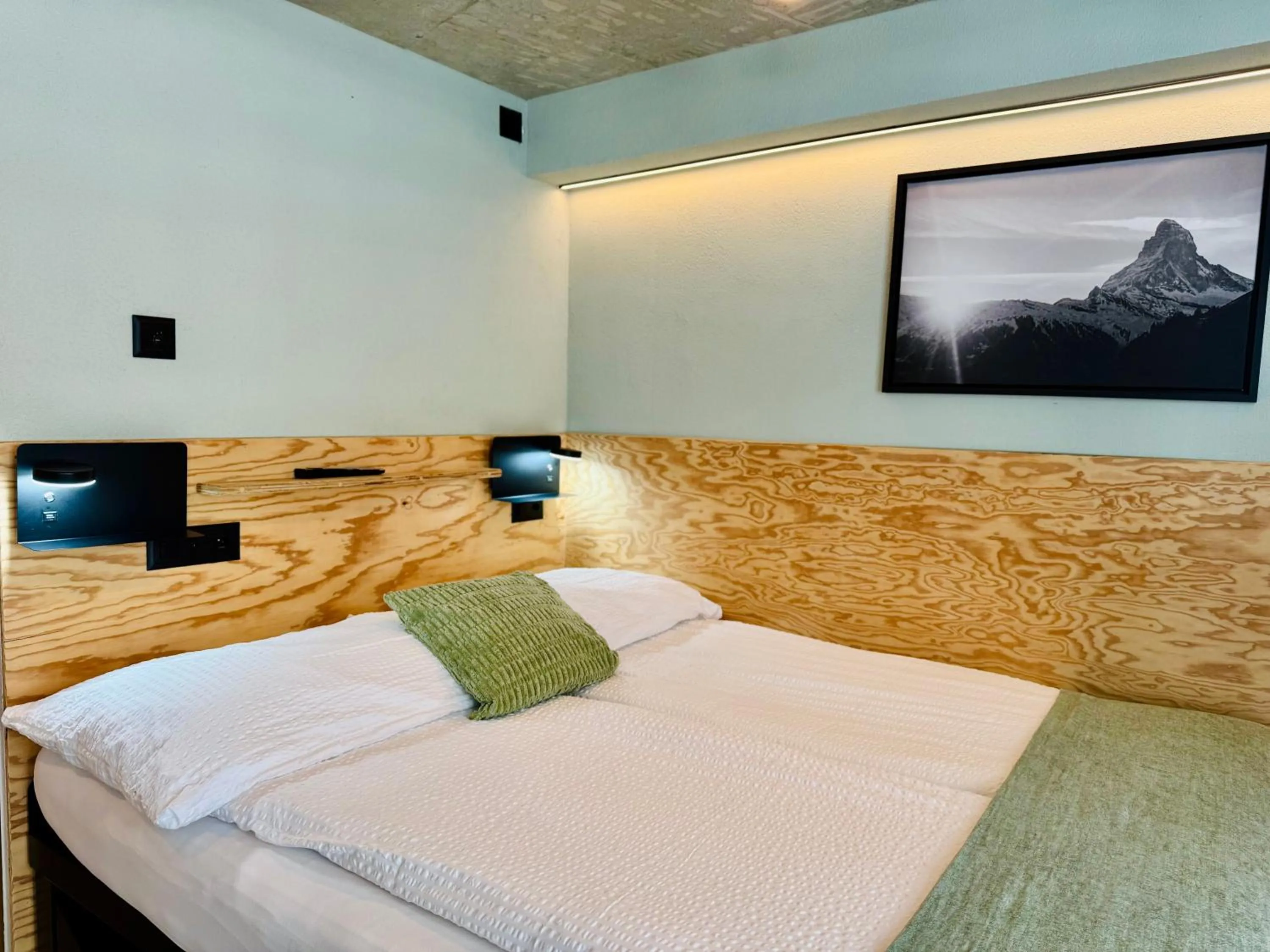 Bed in Peaky Riders Self Check-in Hotel