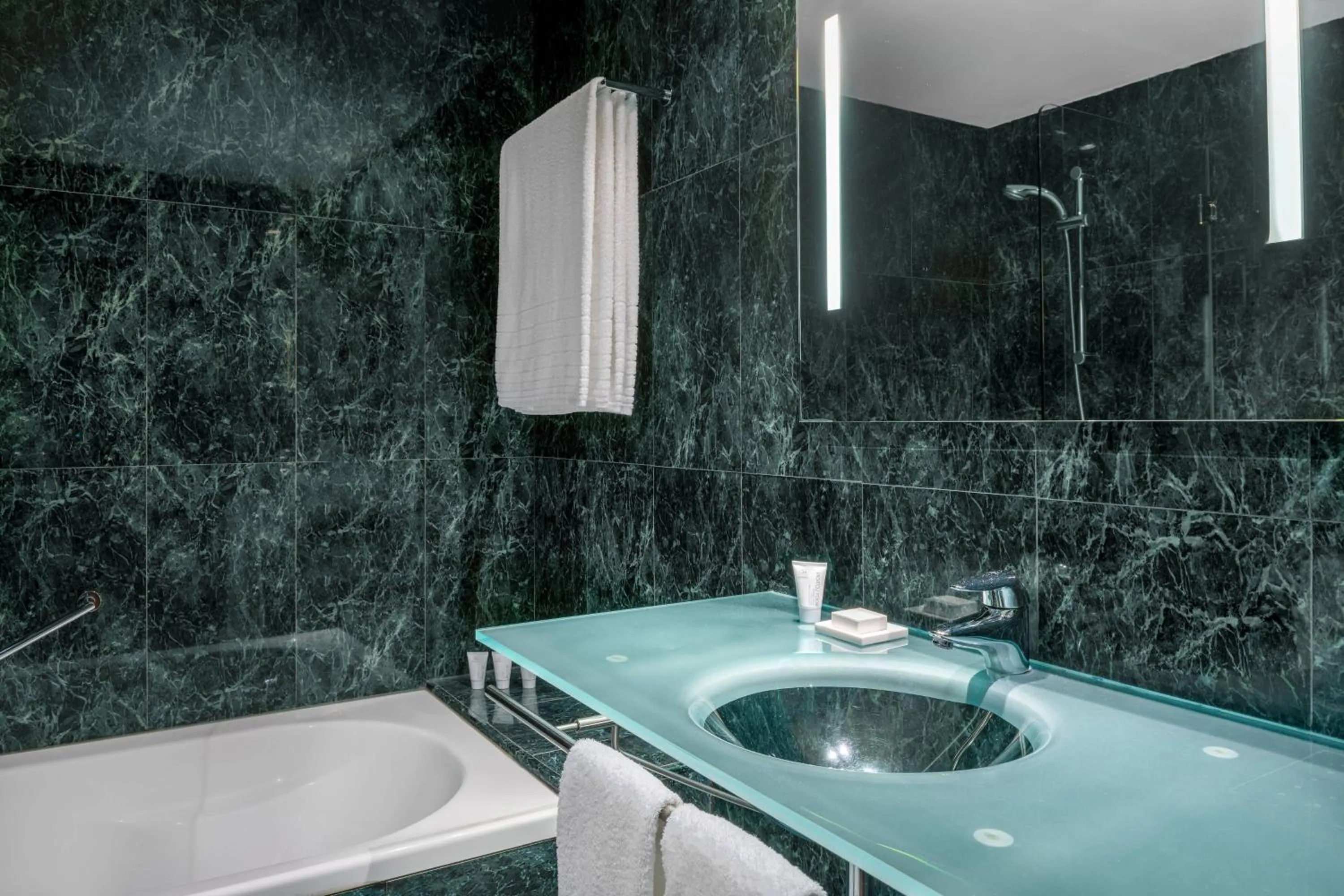 Bathroom in AC Hotel Huelva by Marriott