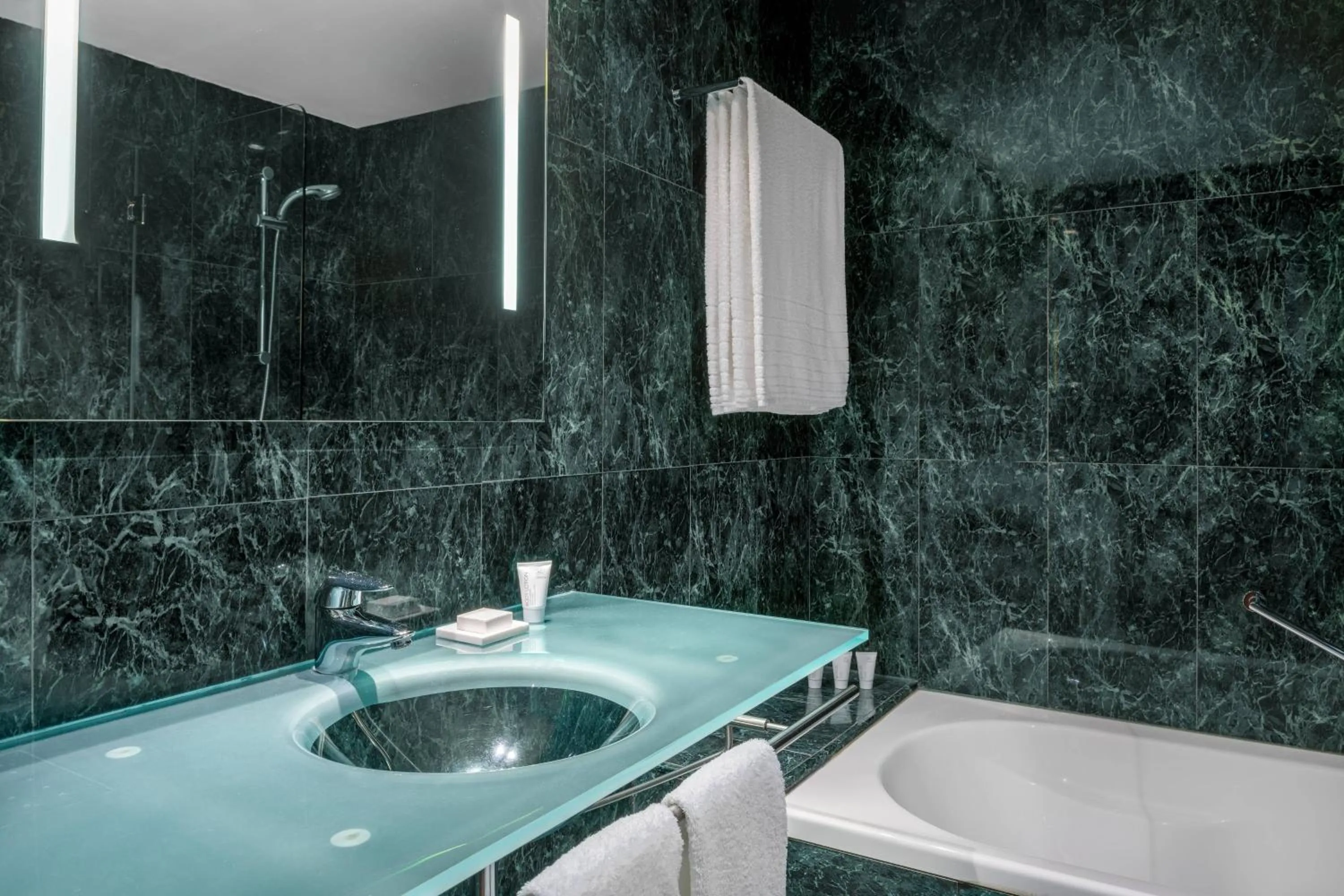 Bathroom in AC Hotel Huelva by Marriott