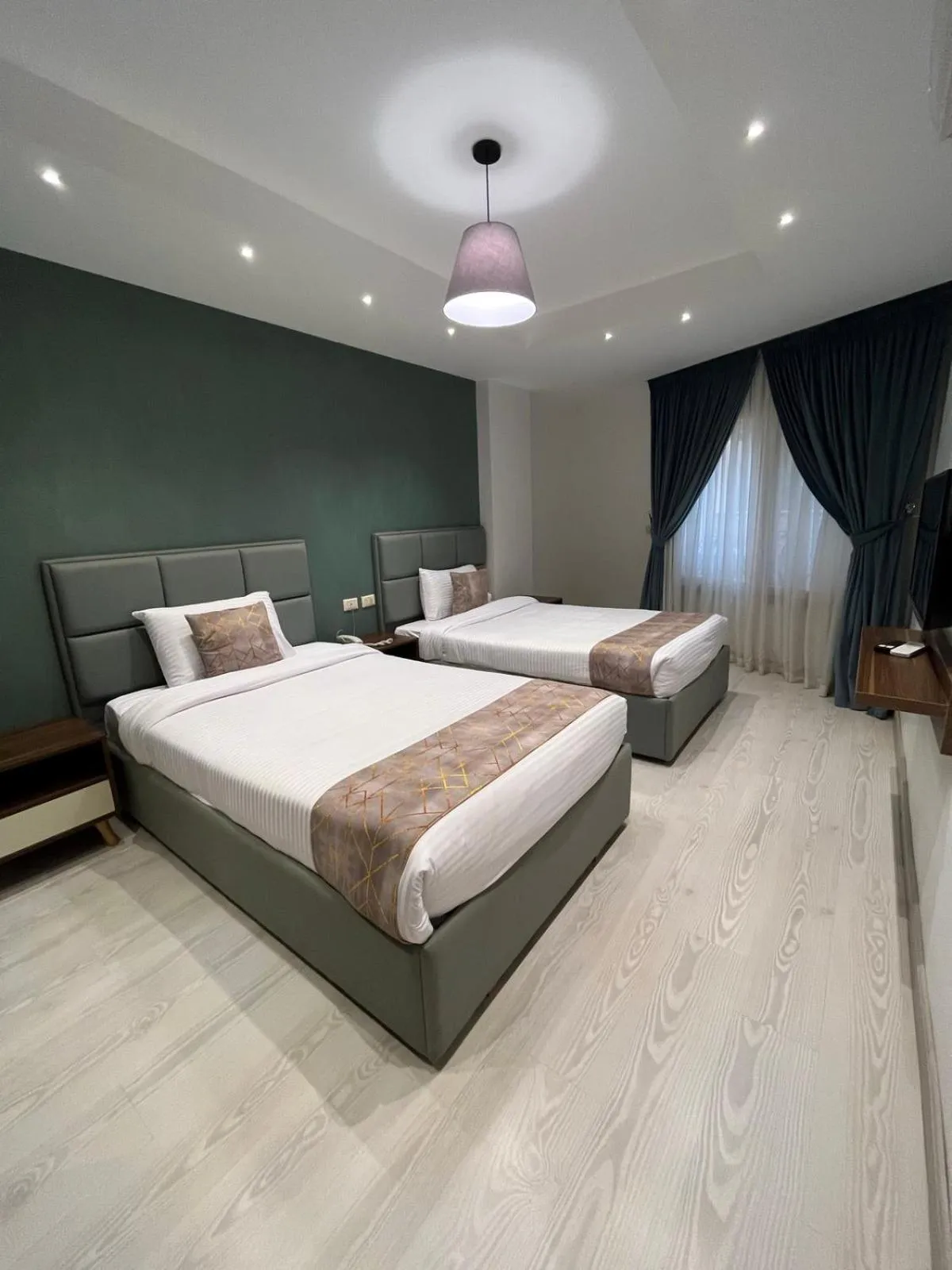 Bed in Jasmine Pyramids Hotel