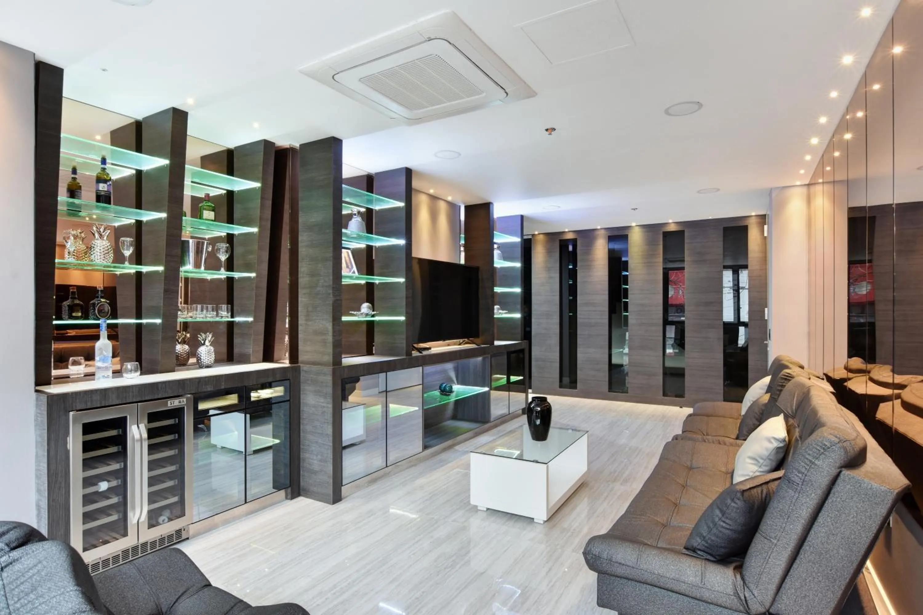 Communal lounge/ TV room in 1Million Luxury Suites