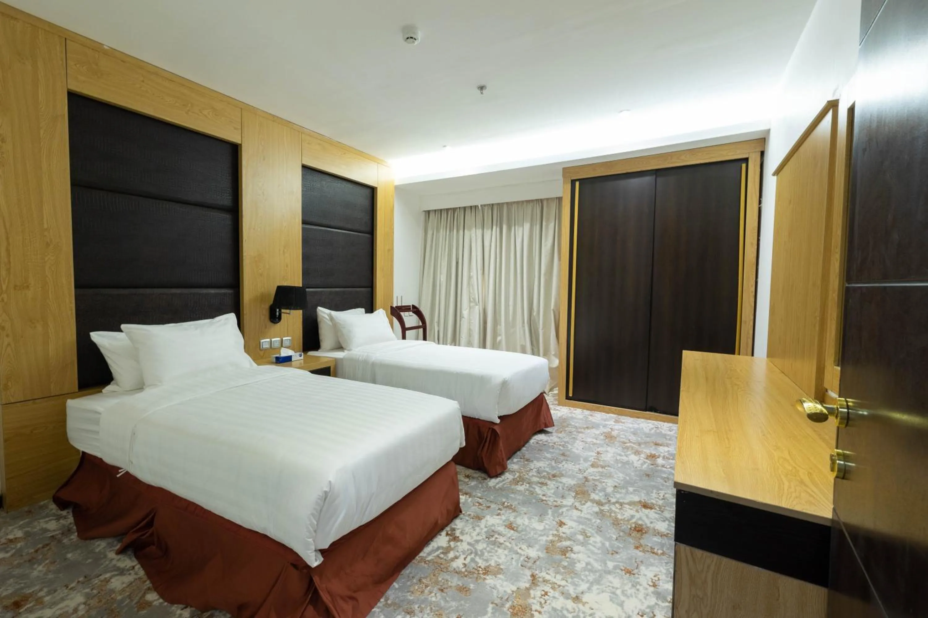 Bed in Mira Business Hotel