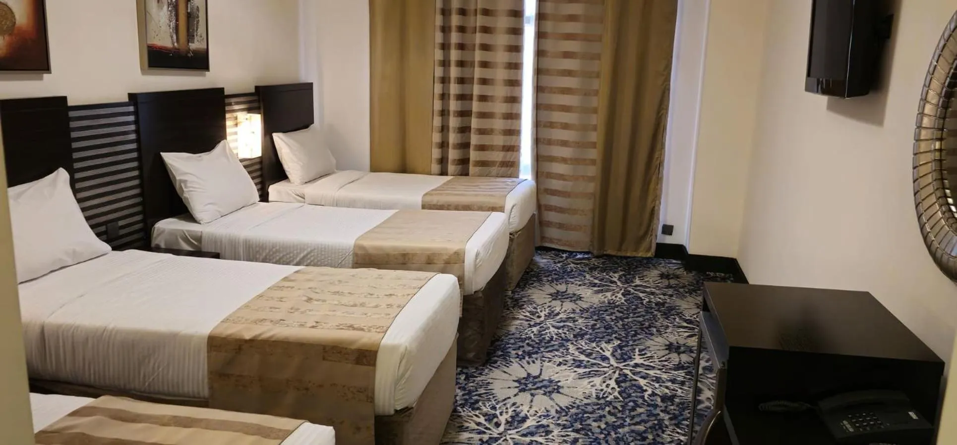 Deluxe Quadruple Room in Al Hidayah Towers Hotel