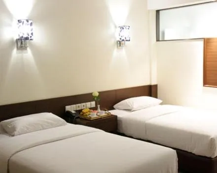 Bed in BAMBOO INN HOTEL & CAFE