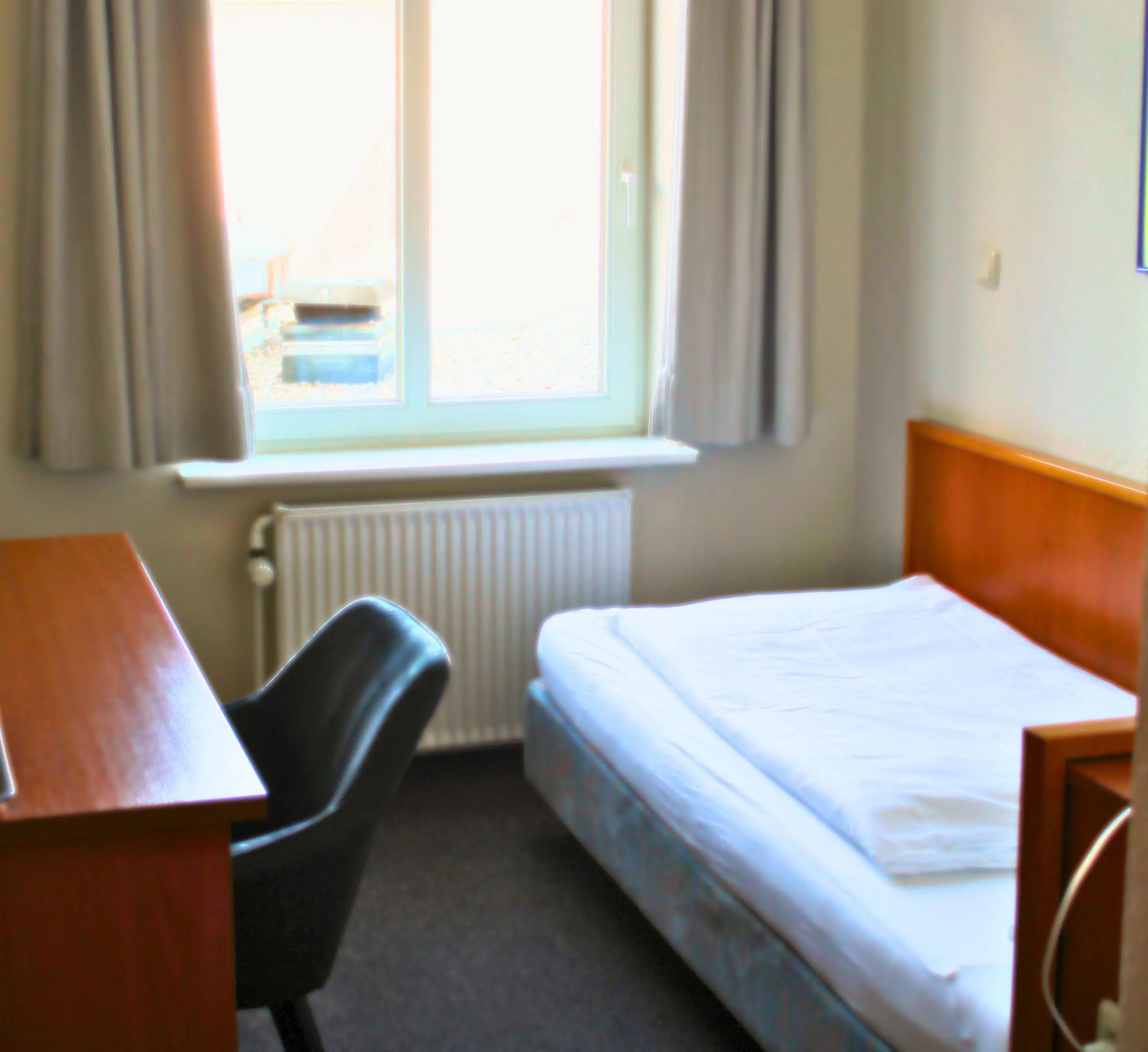 Photo of the whole room, Bed in Hotel Adler & Eventlocation GmbH