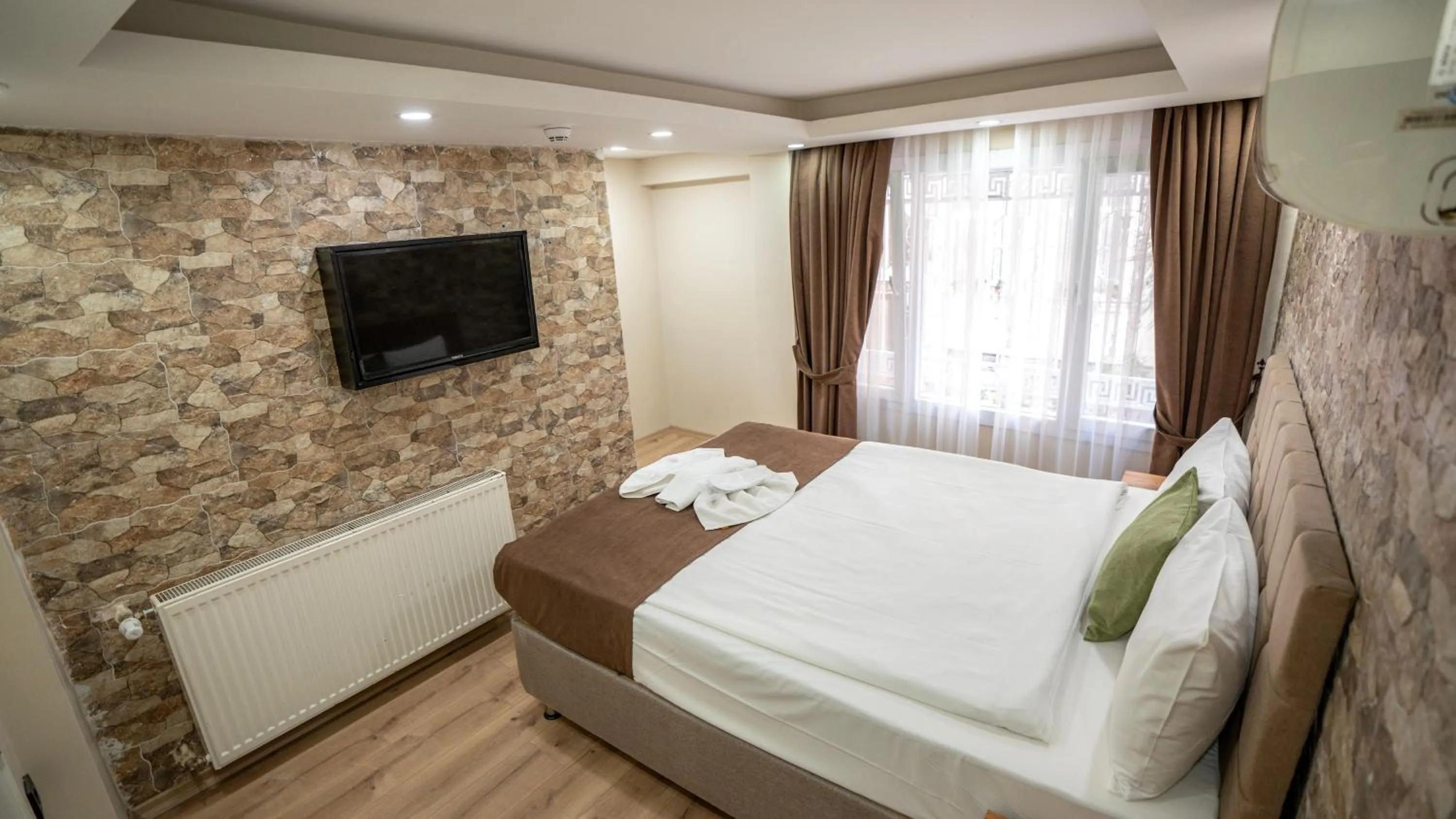 Bed in MİLA SUİTES TAKSİM