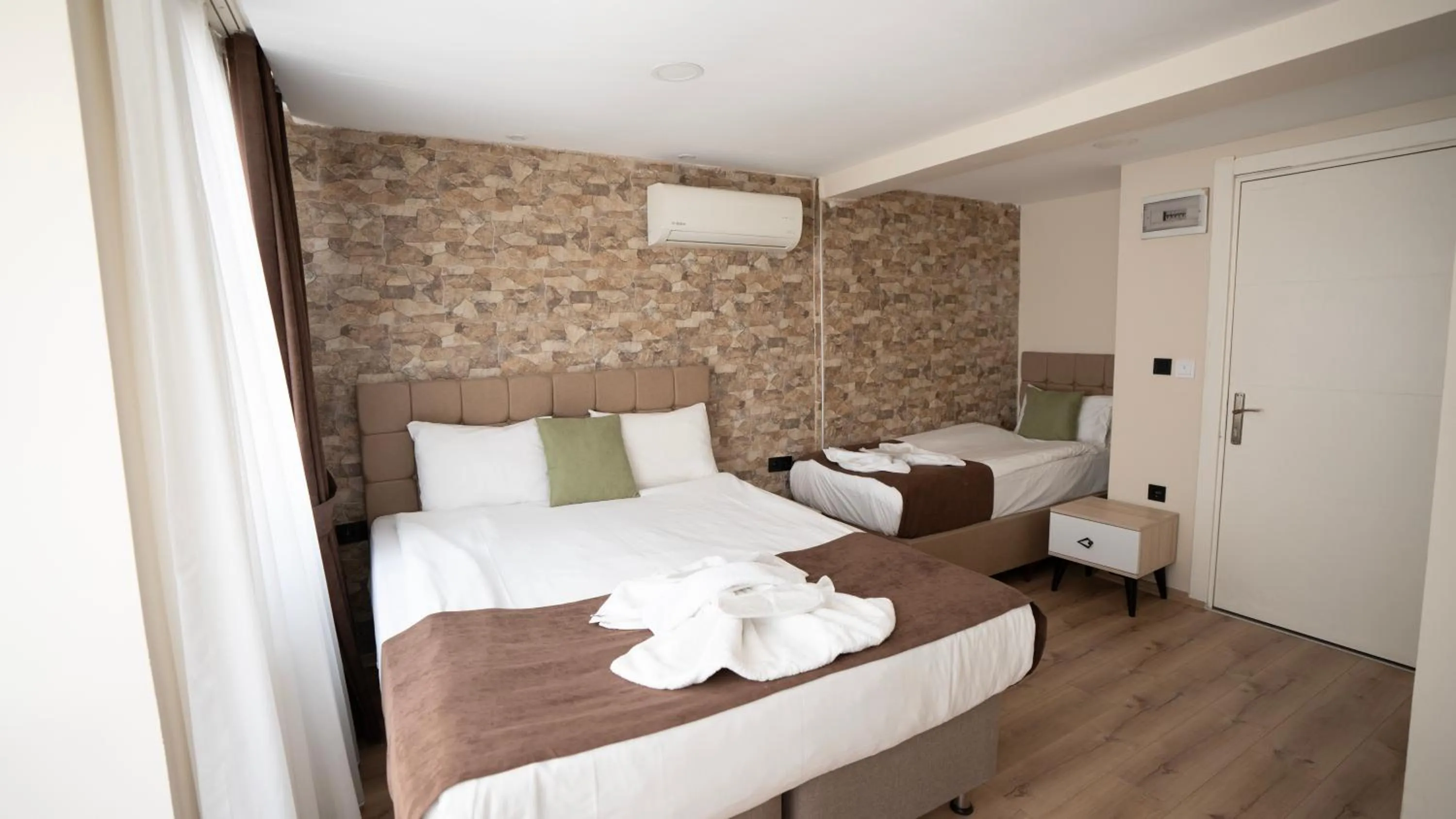 Bed in MİLA SUİTES TAKSİM