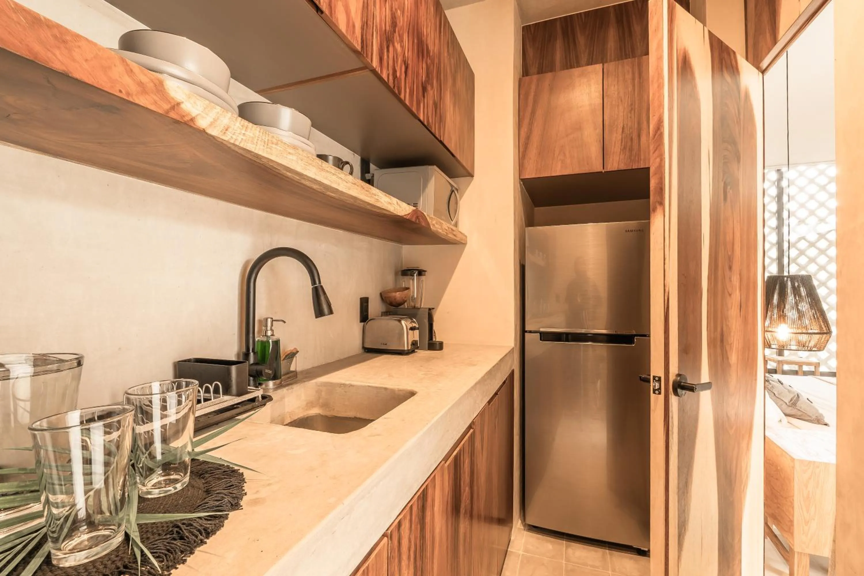 Kitchen or kitchenette in NAJ Boutique Hotel - Aldea Zama
