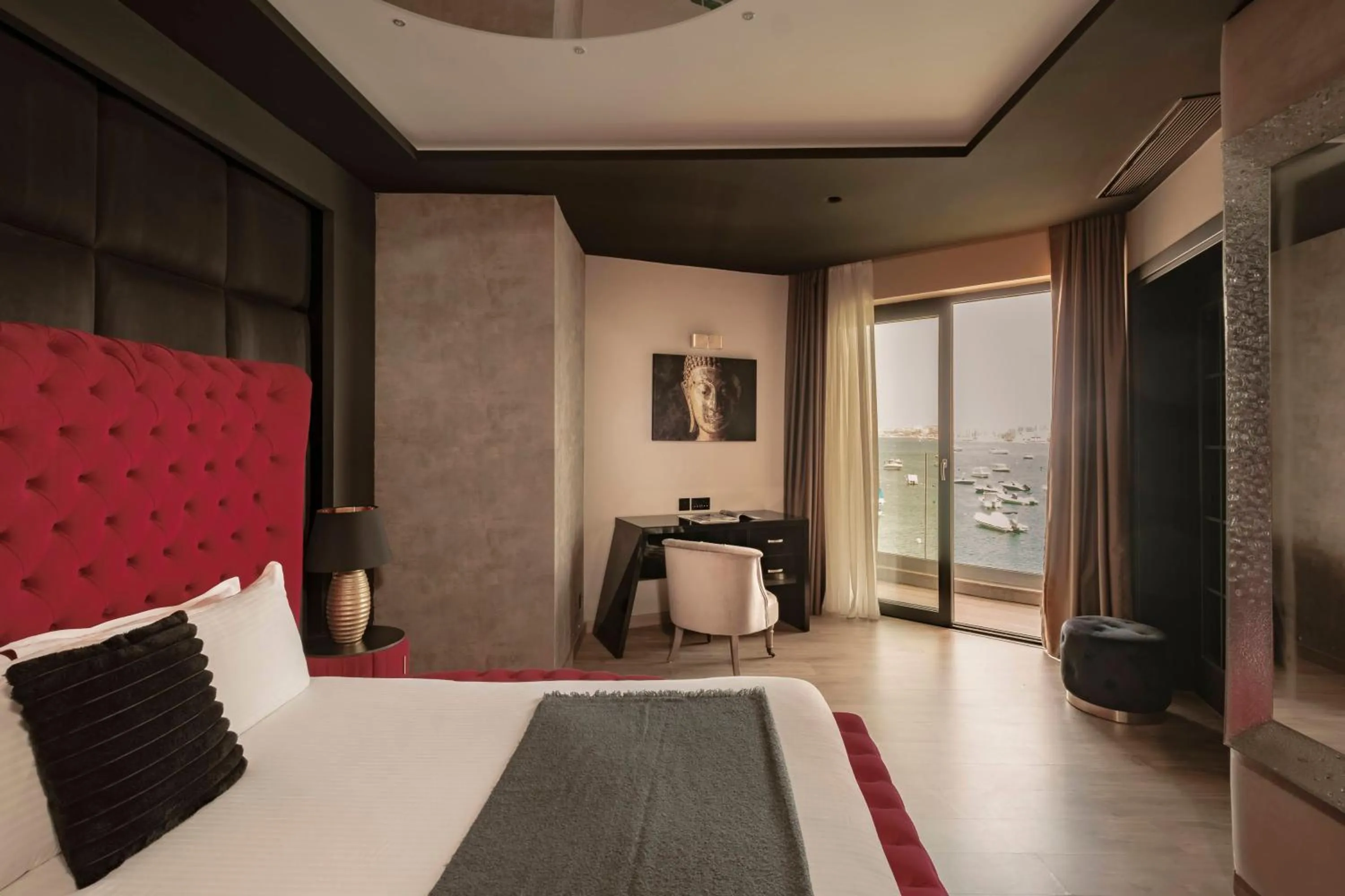 Seating area, Bed in Damare Resort & SPA