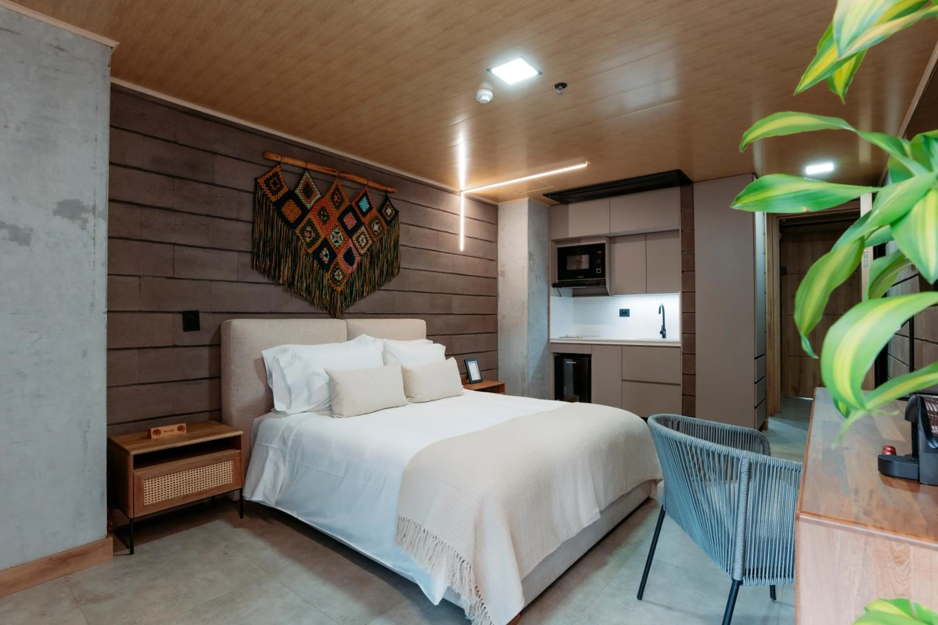 Bed in Hotel Living by Armoniko