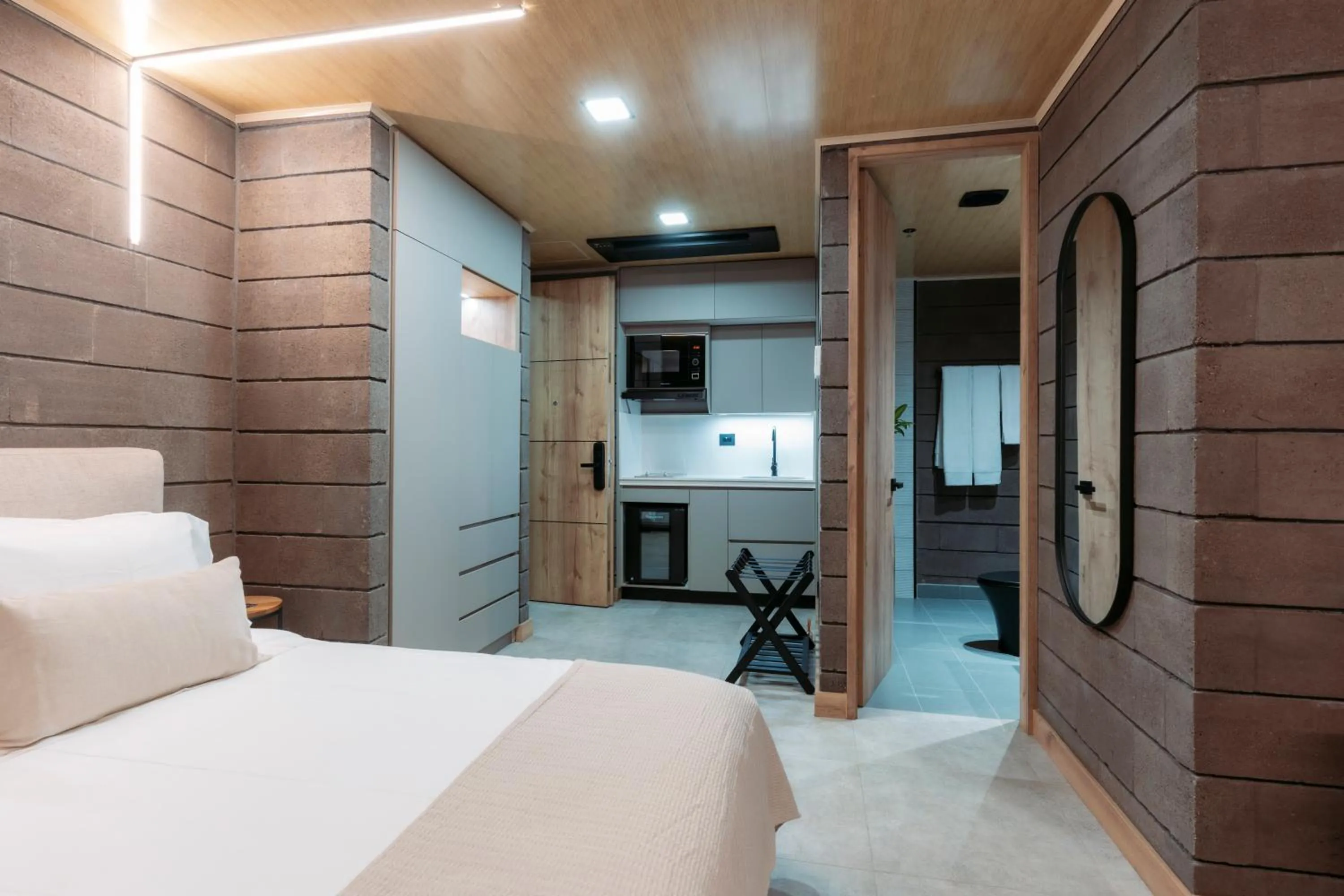 Bed in Hotel Living by Armoniko