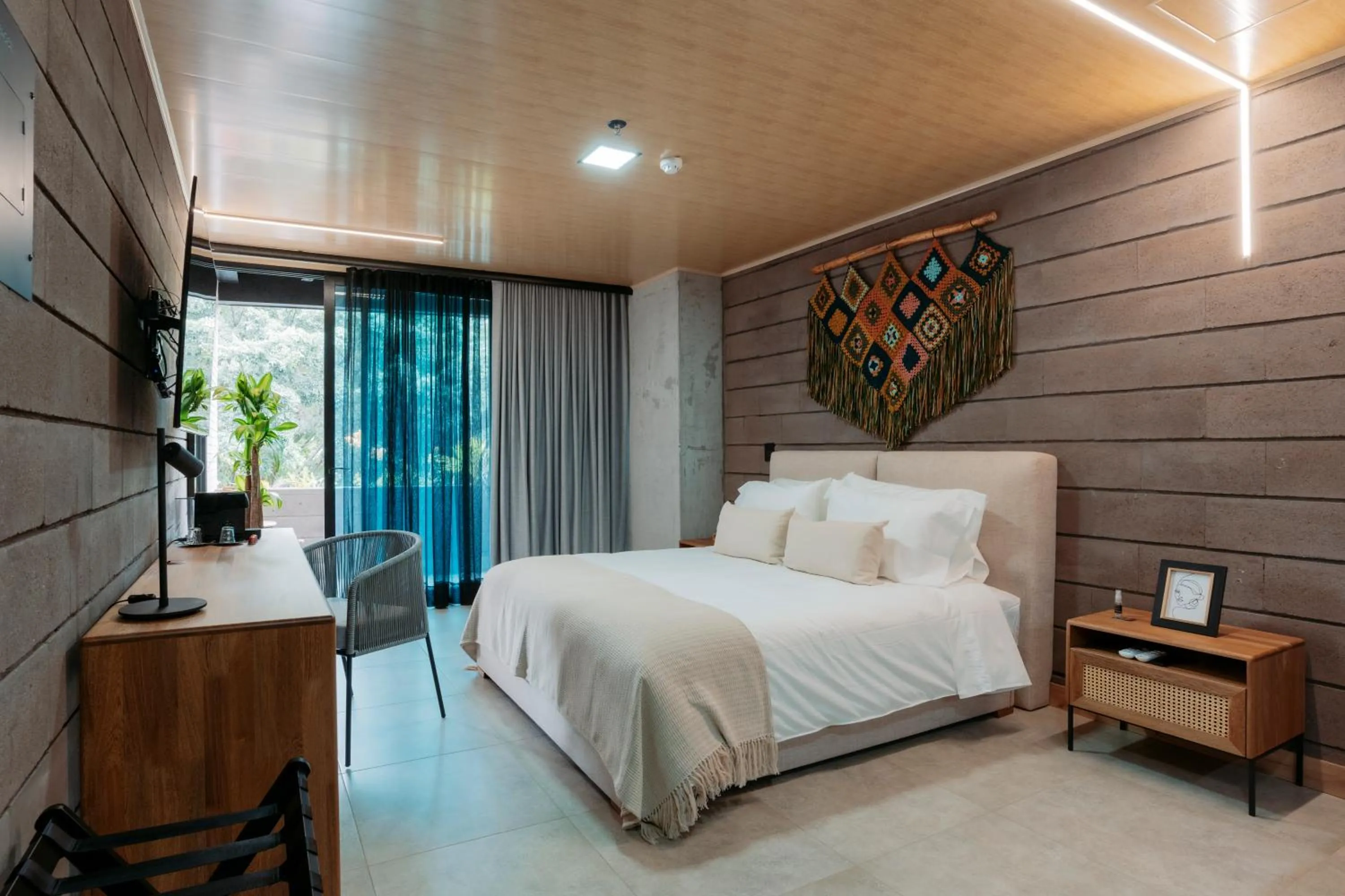 Bed in Hotel Living by Armoniko