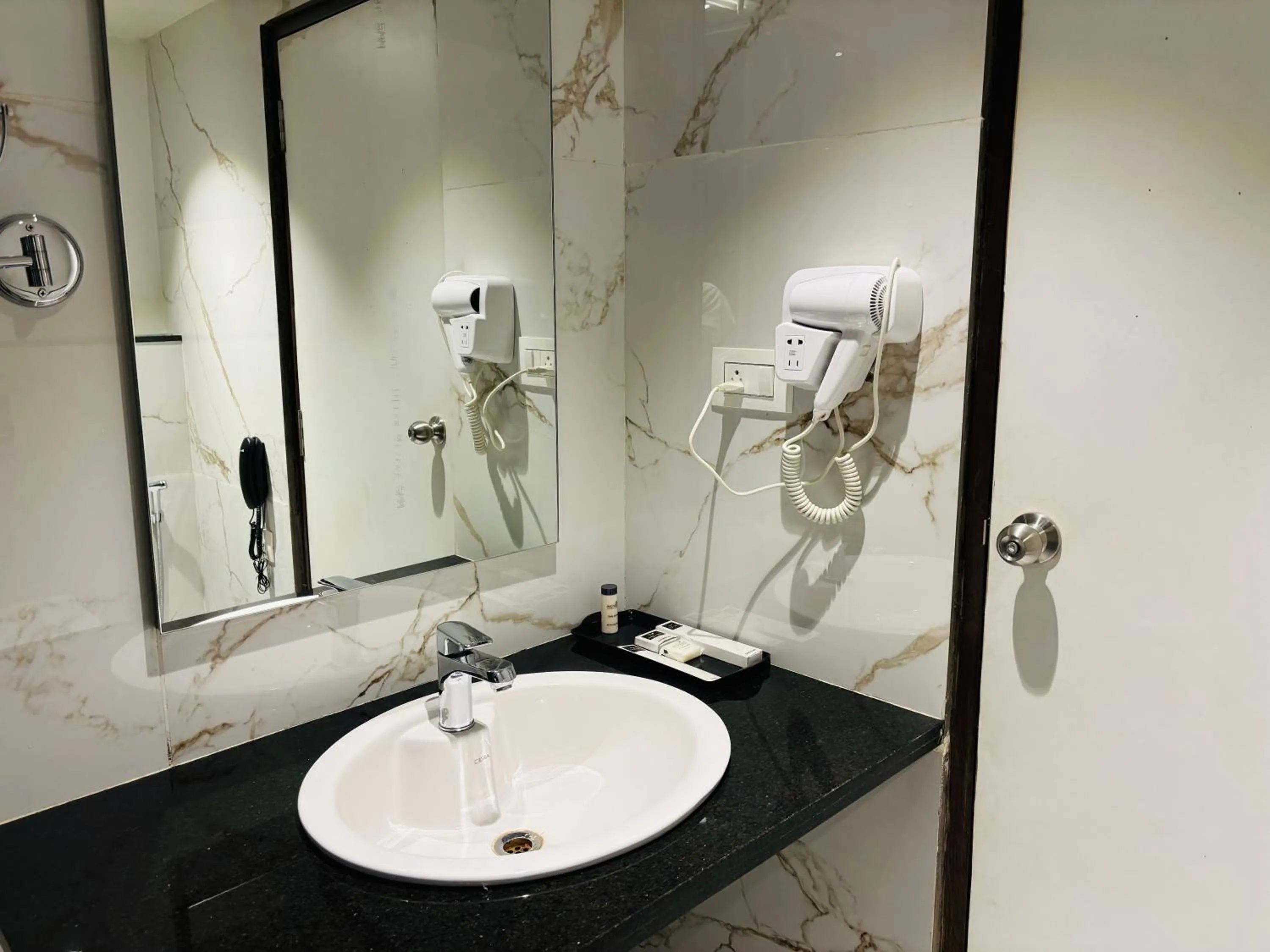 Bathroom in Mayur Belgaum Presidency Hotel & Spa