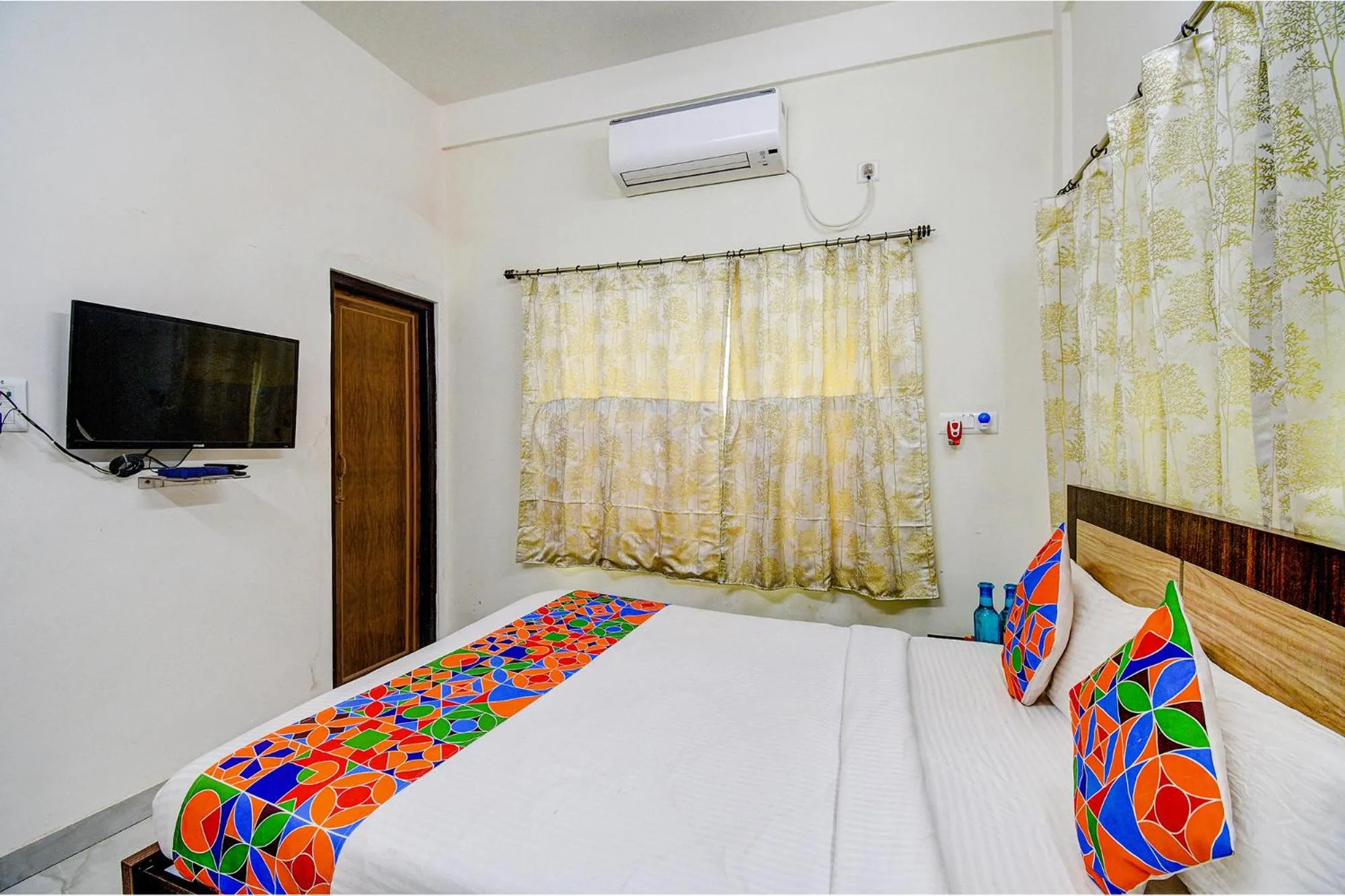 Bed in FabHotel Moon Residency