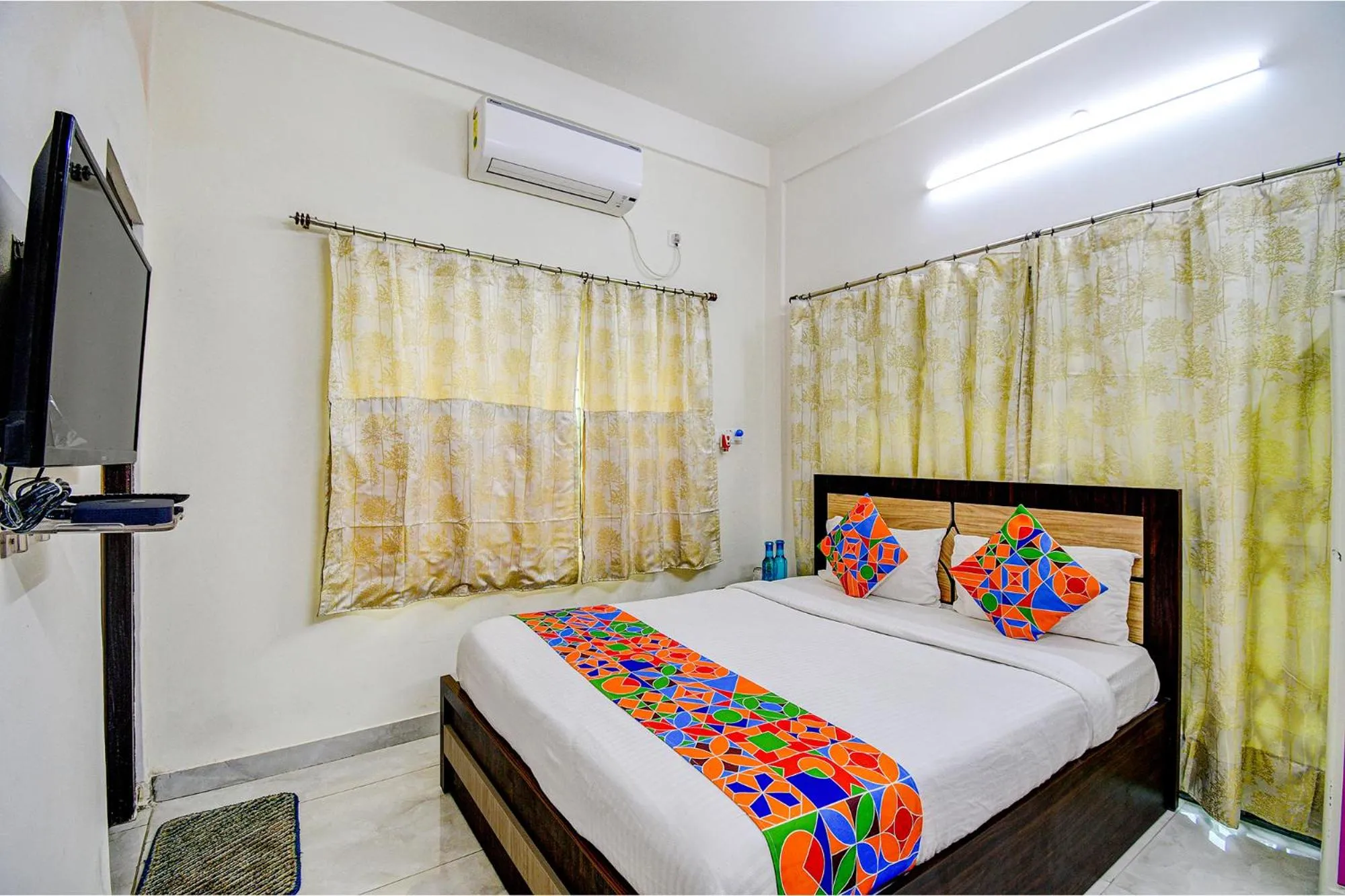 Bed in FabHotel Moon Residency