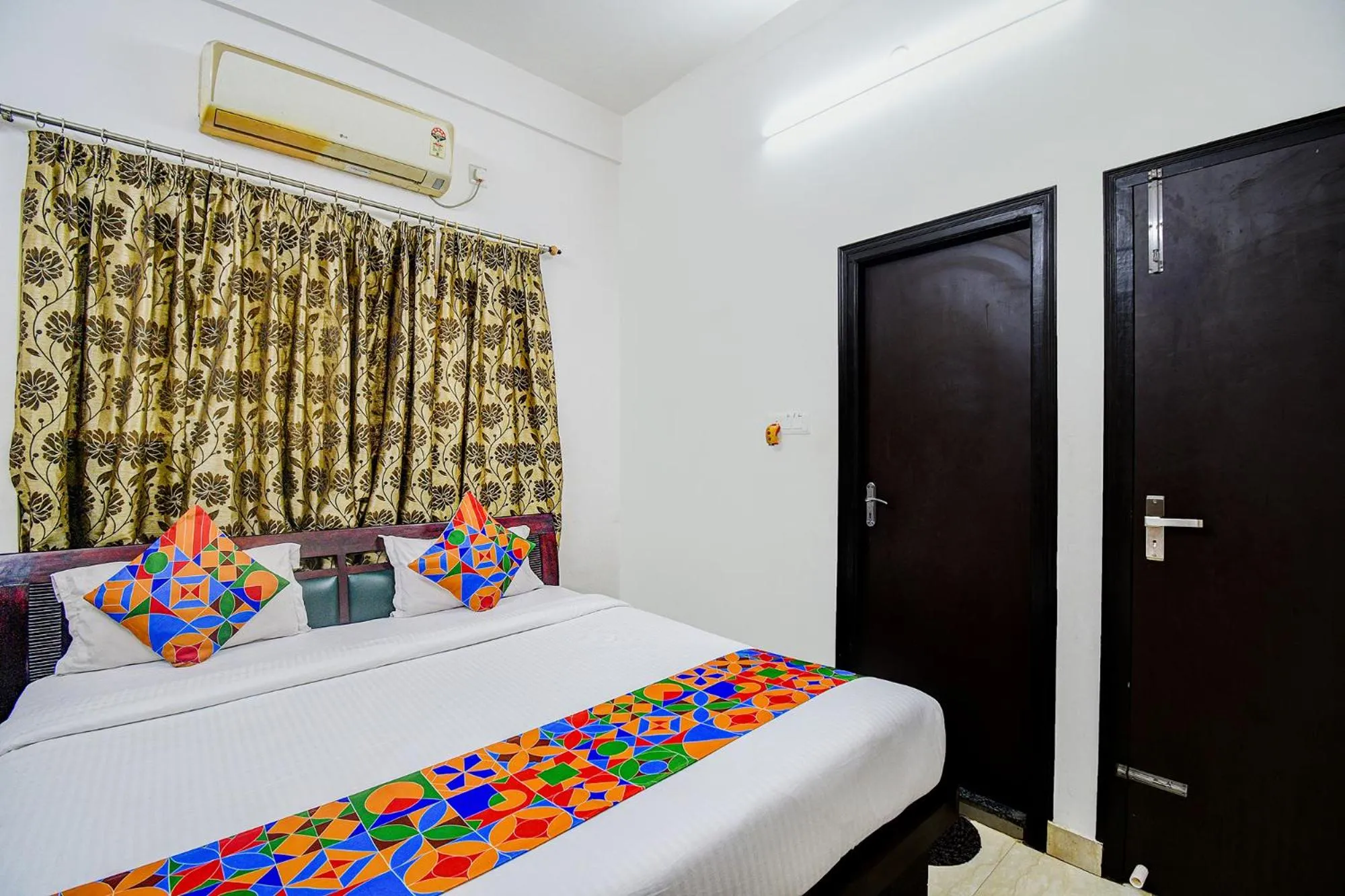 Bed in FabHotel Moon Residency
