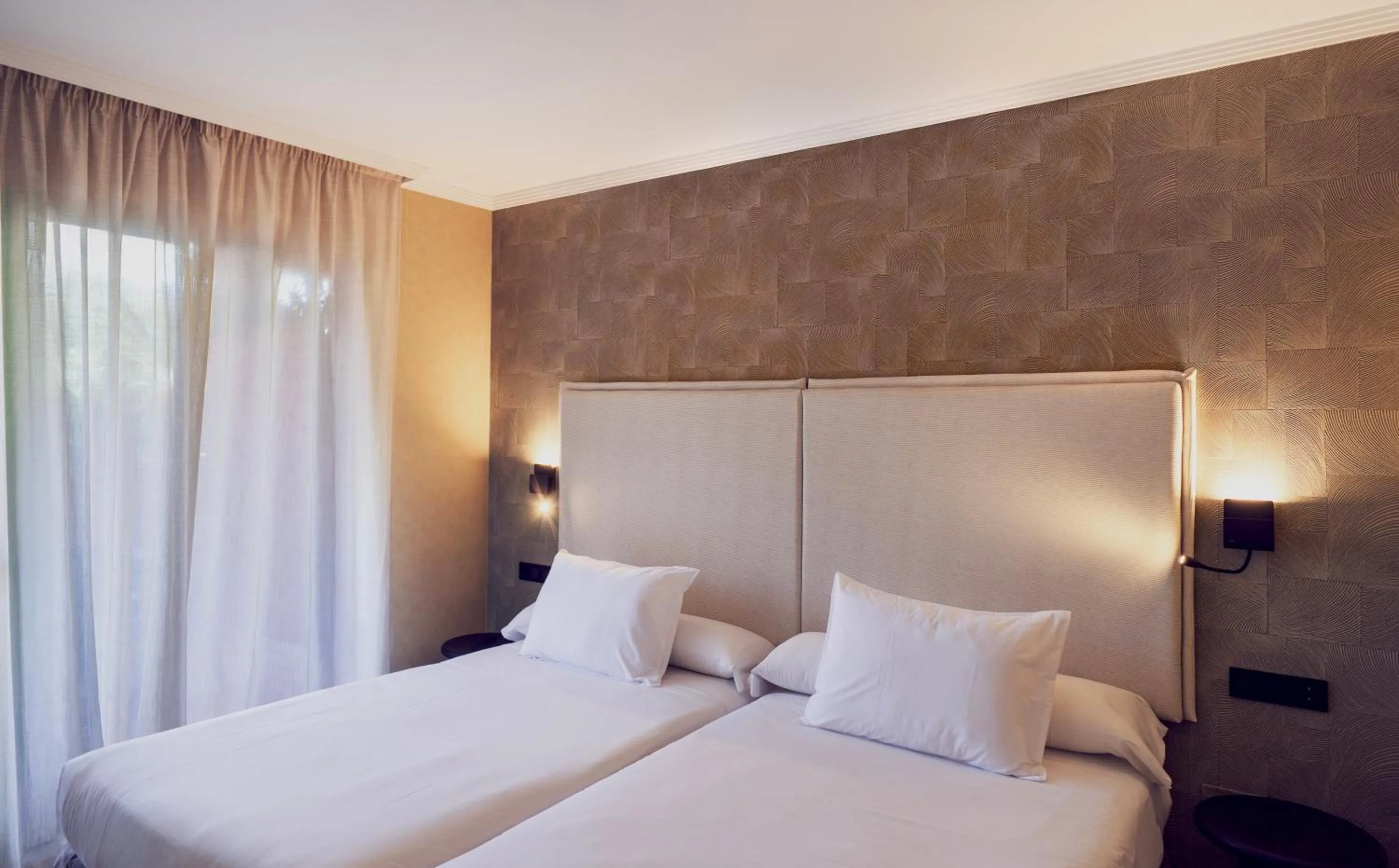 Bed in Holiday World RIWO Hotel.