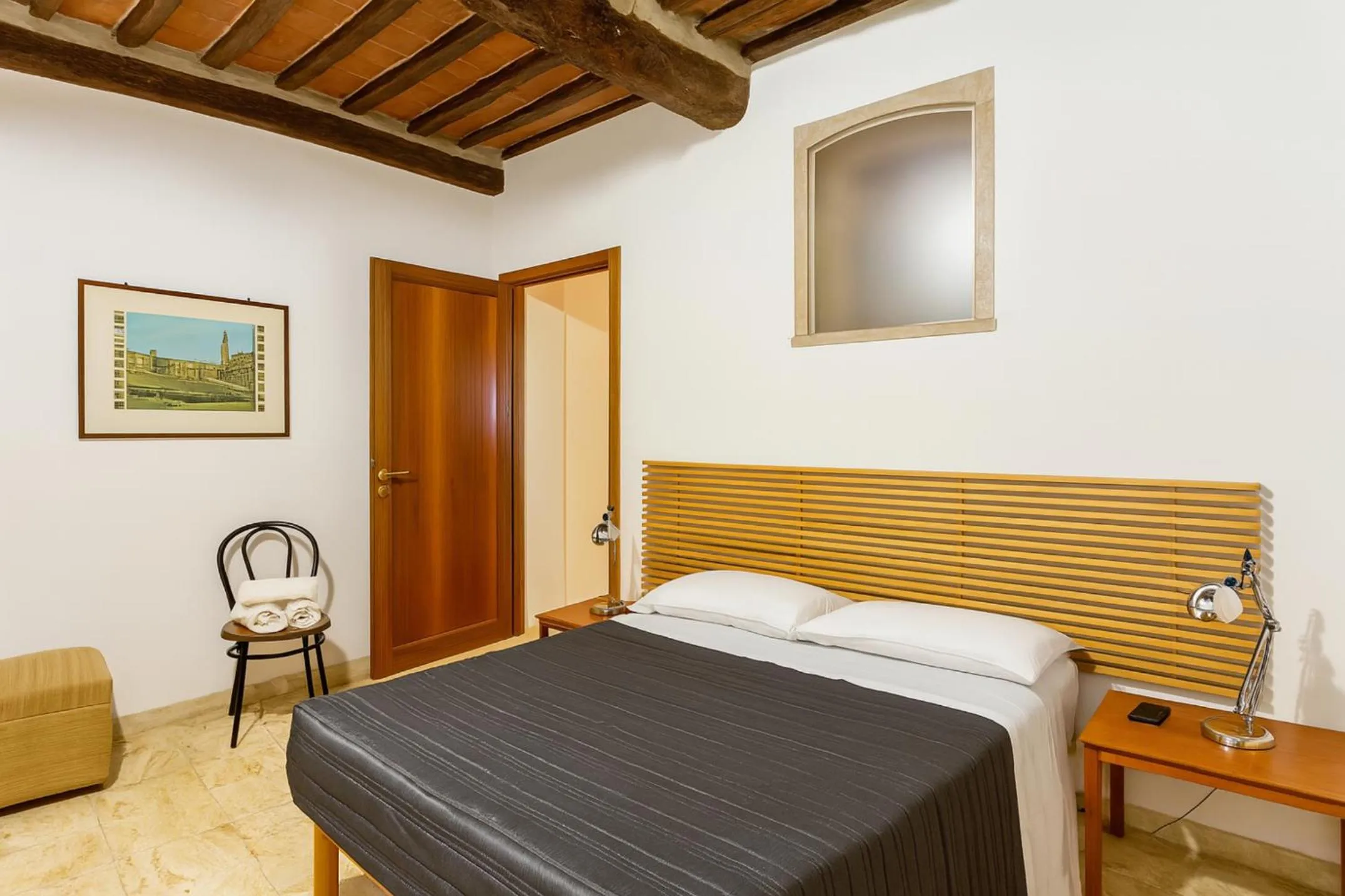 Bed in The Balcony Suite - Piazza del Campo