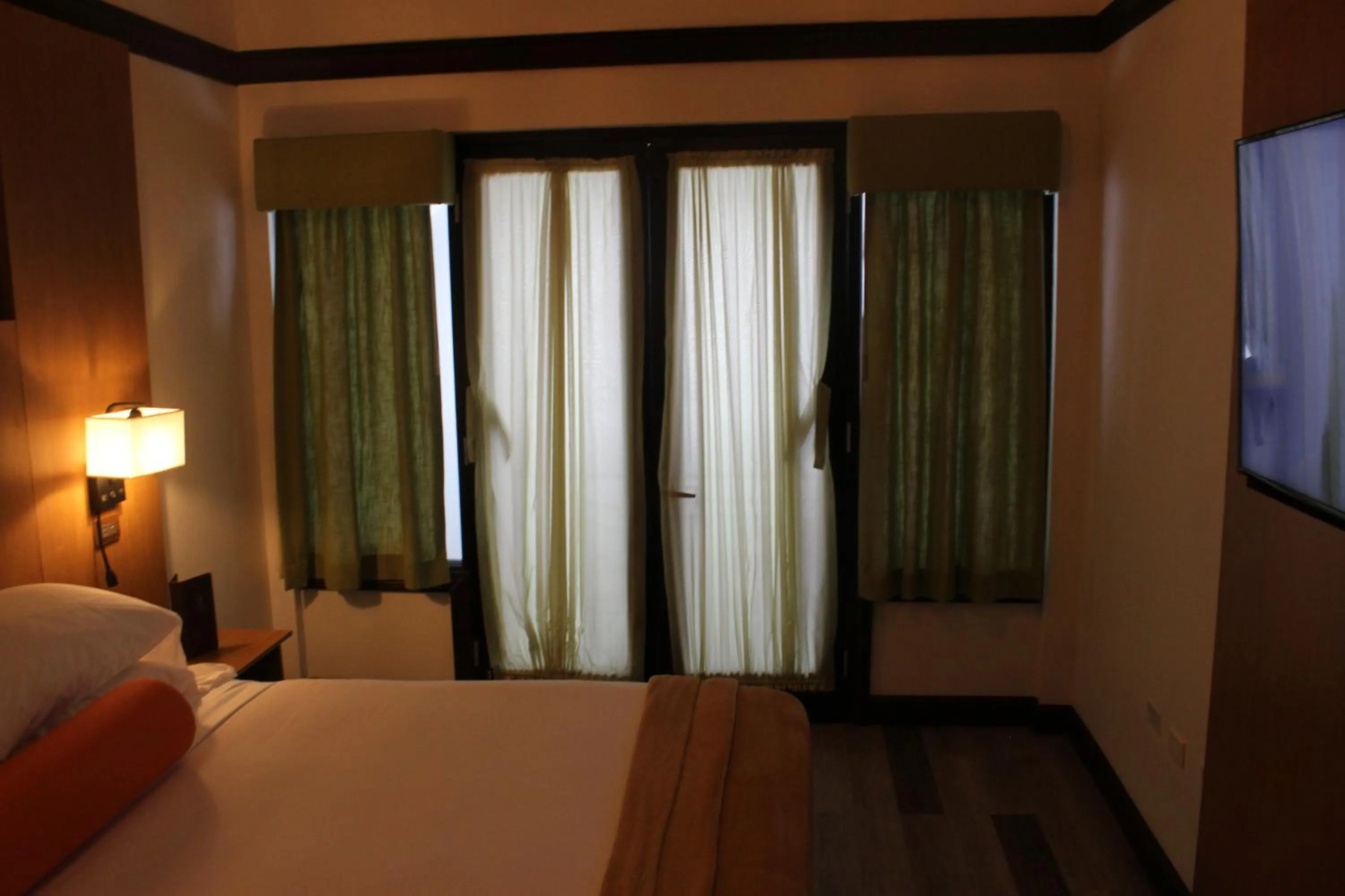 Bed in Sago Palm Hotel