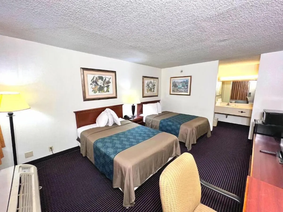 Bed in Heritage Inn & Suites by Capital O Baton Rouge I 10