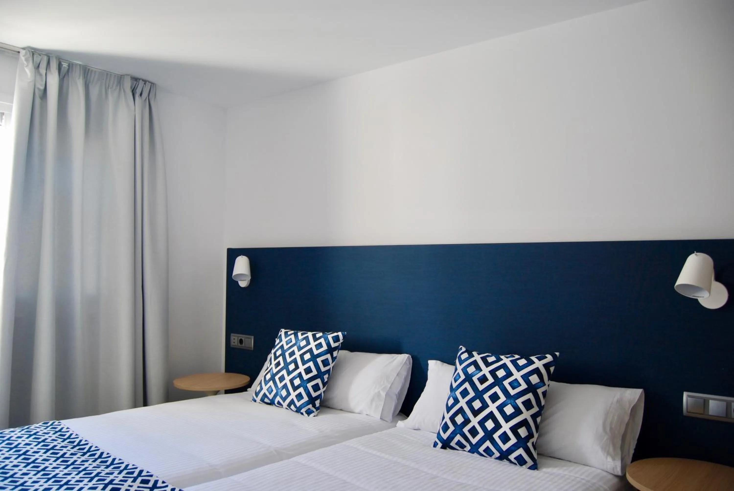 Bed in Broncemar Beach Suites