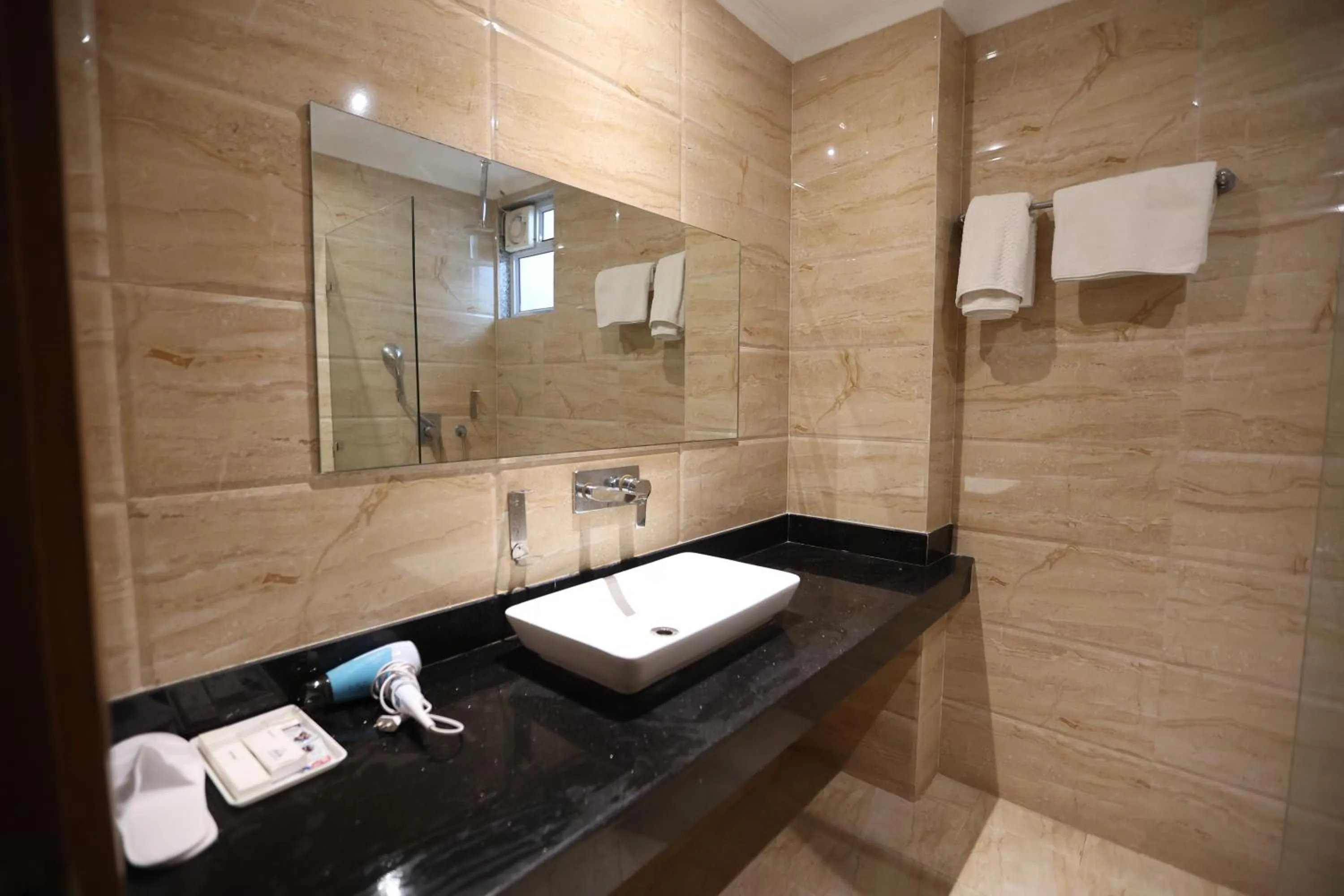 Shower in The Elevate Hotel Near Delhi Airport With- Free Airport PICKUP