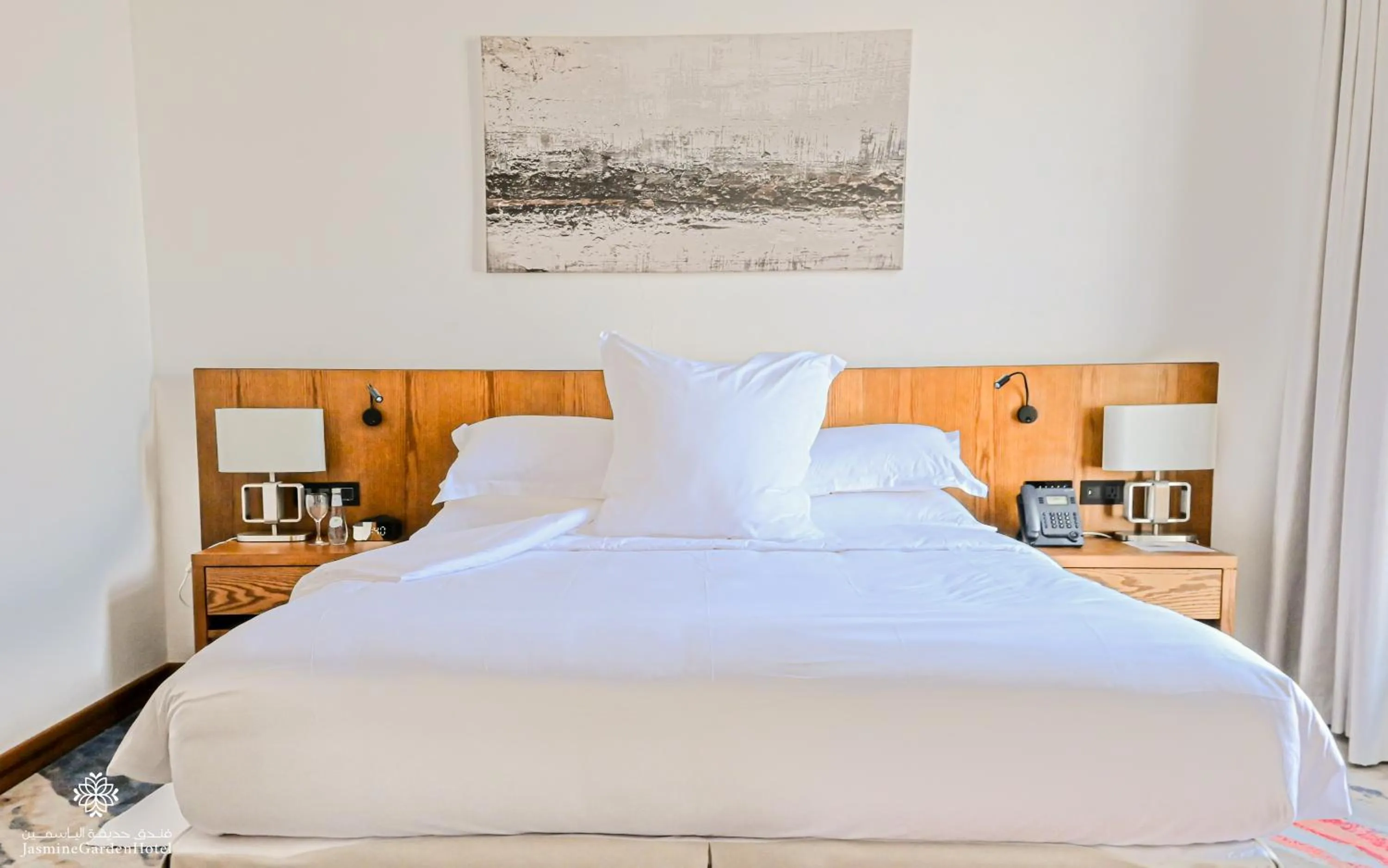 Bed in Jasmine Garden Hotel