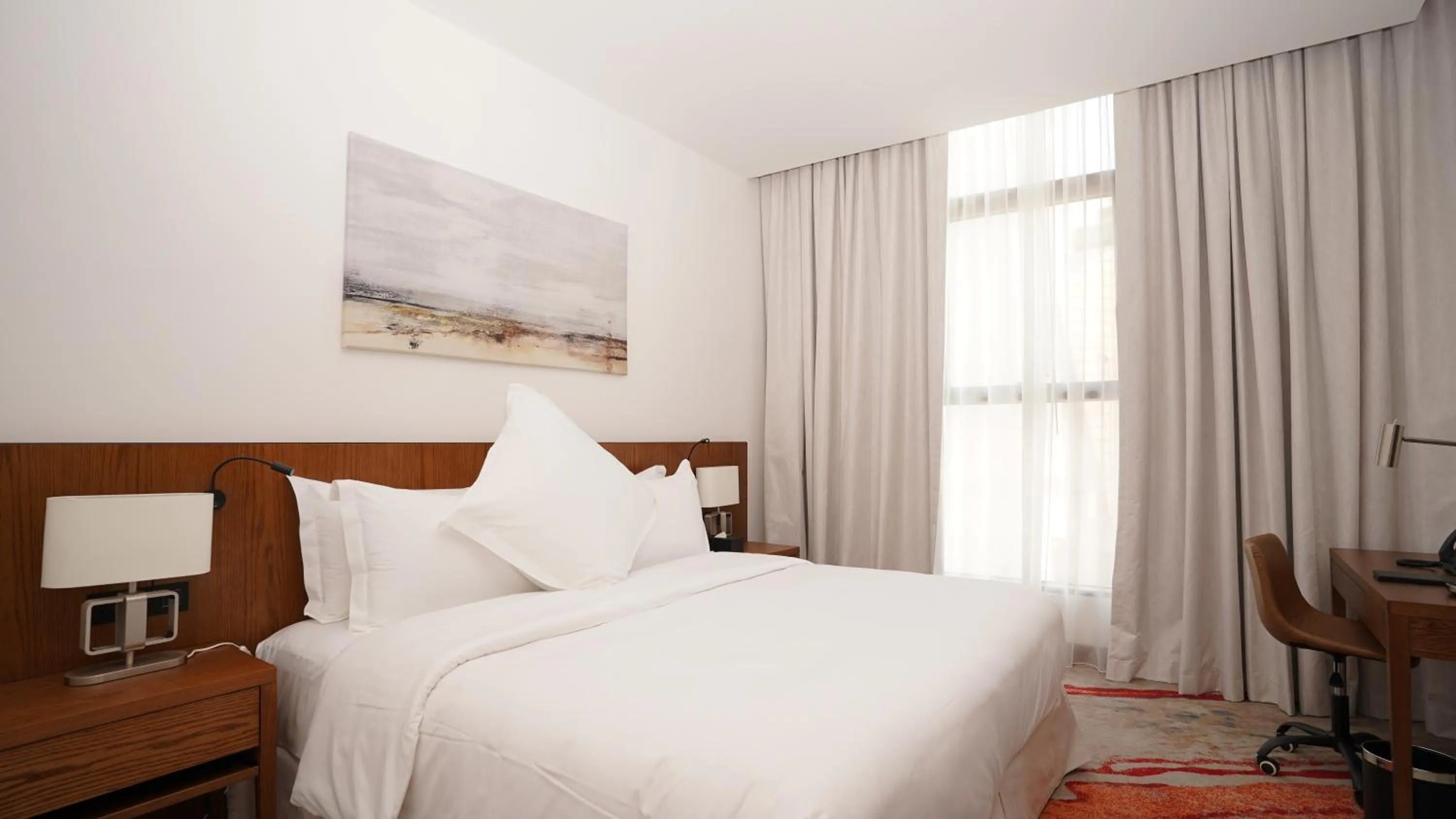 Bed in Jasmine Garden Hotel