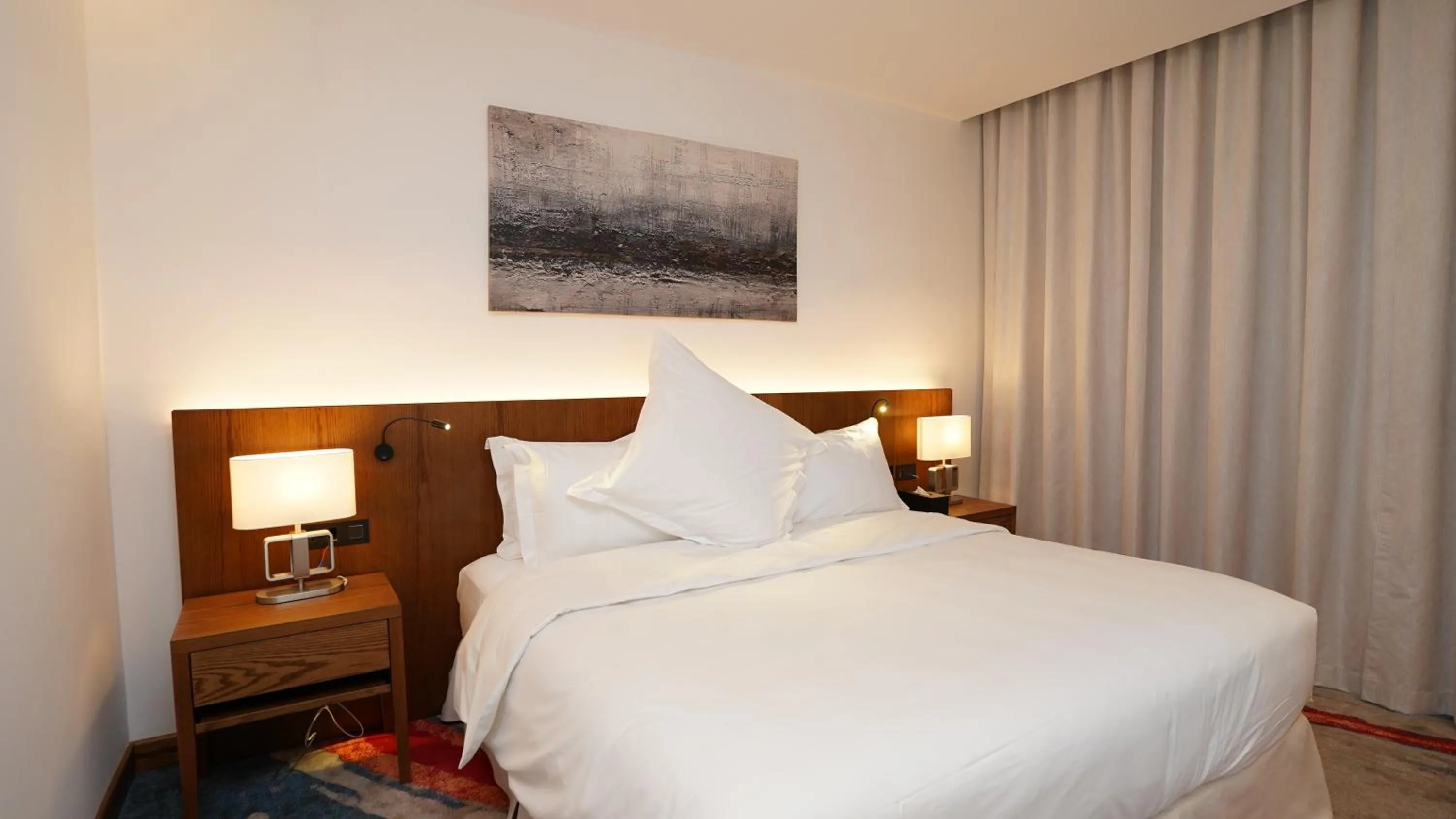 Bed in Jasmine Garden Hotel