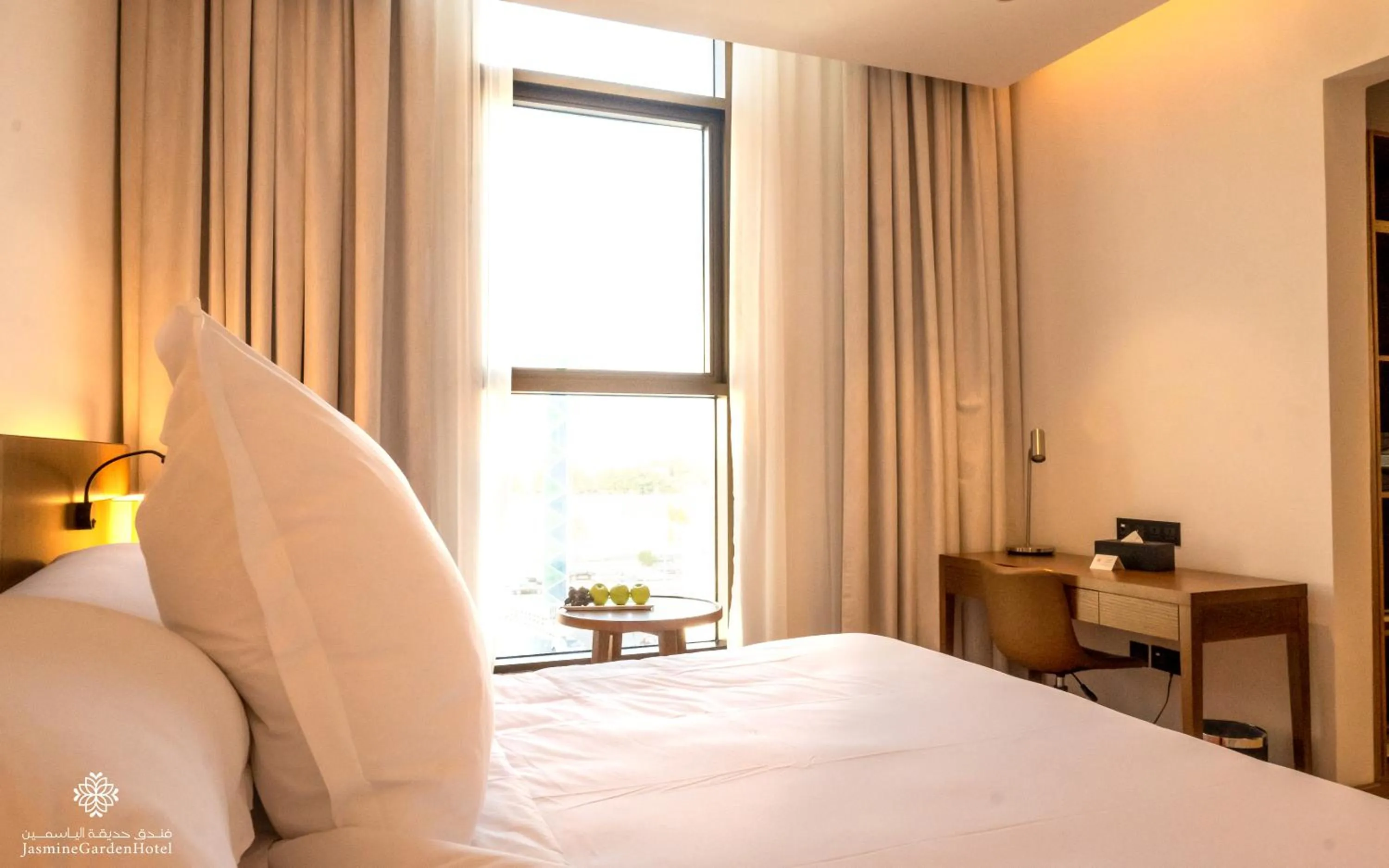 Bed in Jasmine Garden Hotel