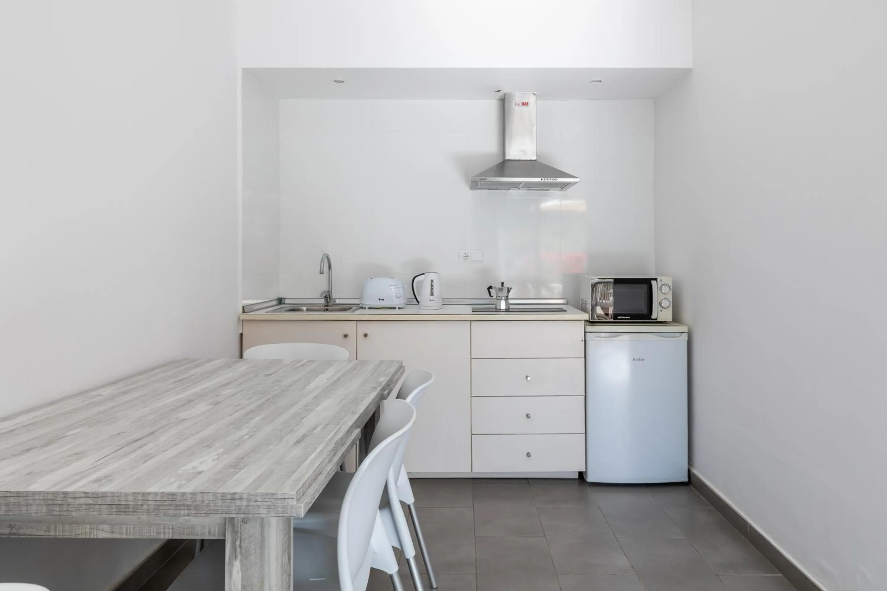 Kitchen or kitchenette in Aparthotel Puerto Cala Vadella