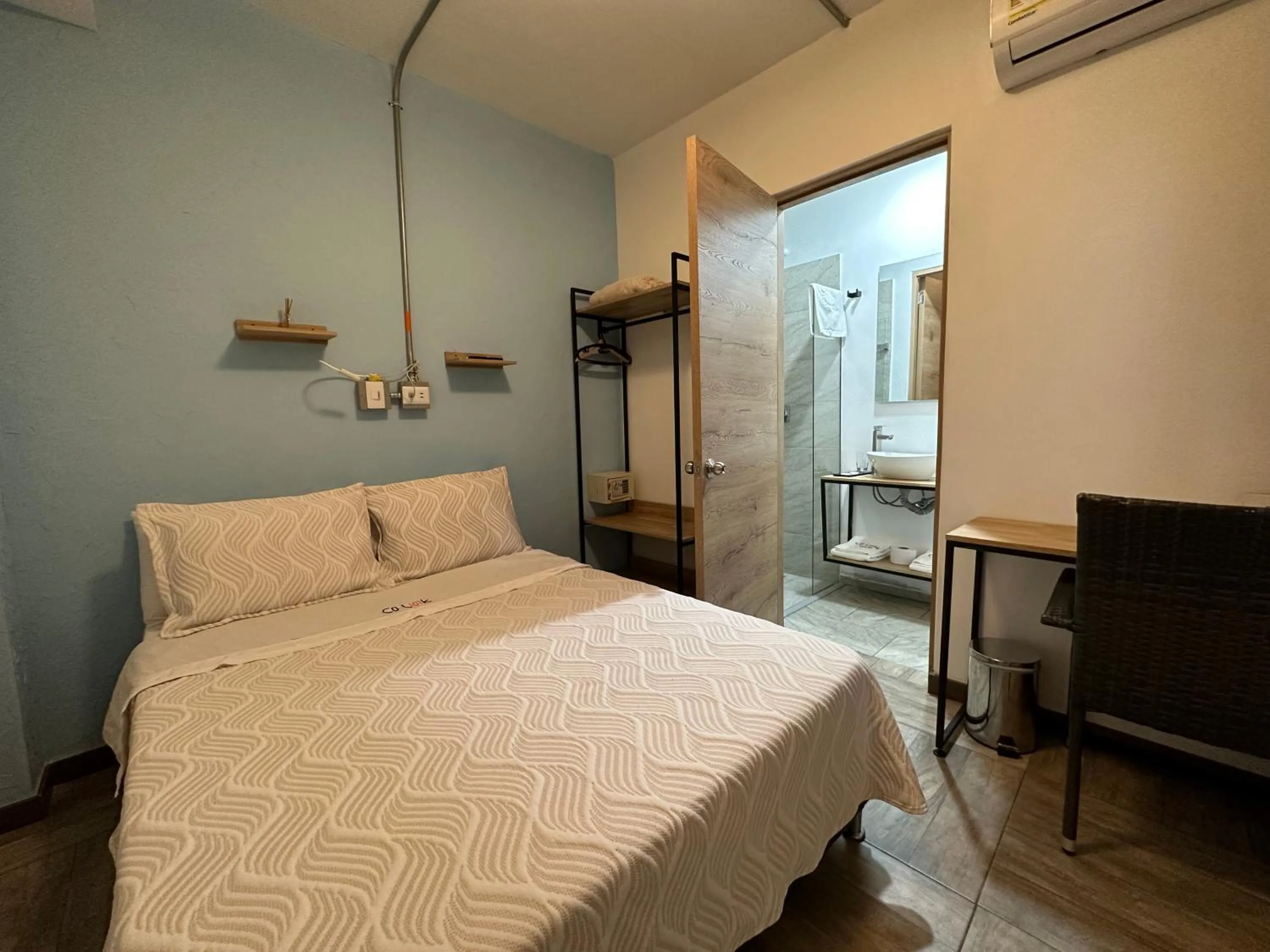 Bed in CoLinkHouse Hotel