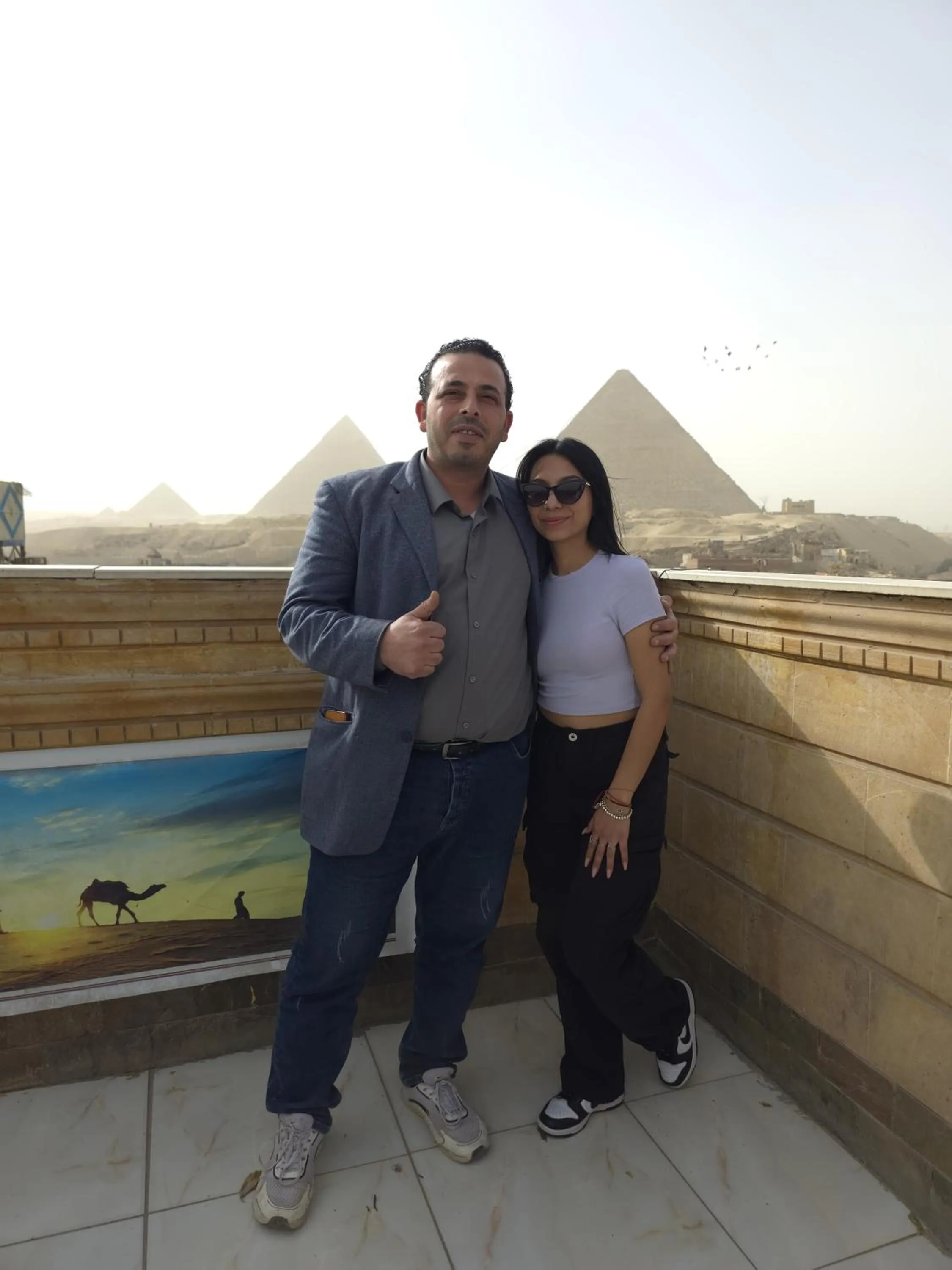 group of guests in Zeina pyramids view