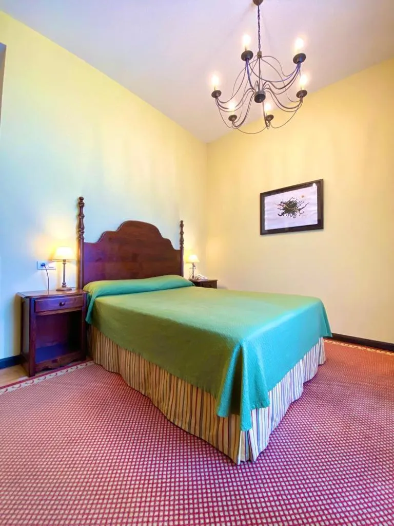 Bed in Hotel Pazo de Lestrove by Pousadas de Compostela