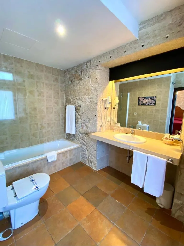 Toilet in Hotel Pazo de Lestrove by Pousadas de Compostela