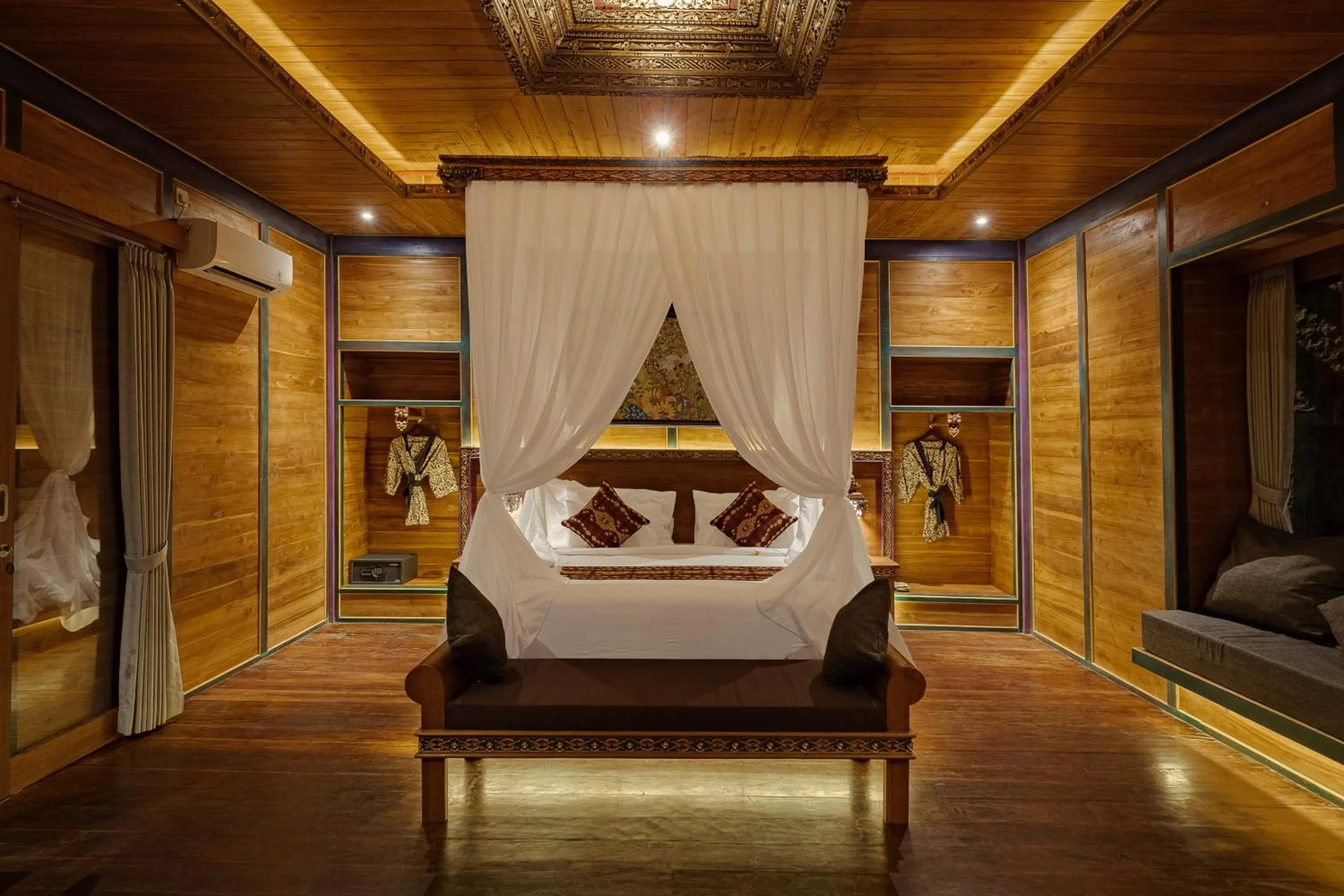 Bed in Gynandha Ubud Cottage