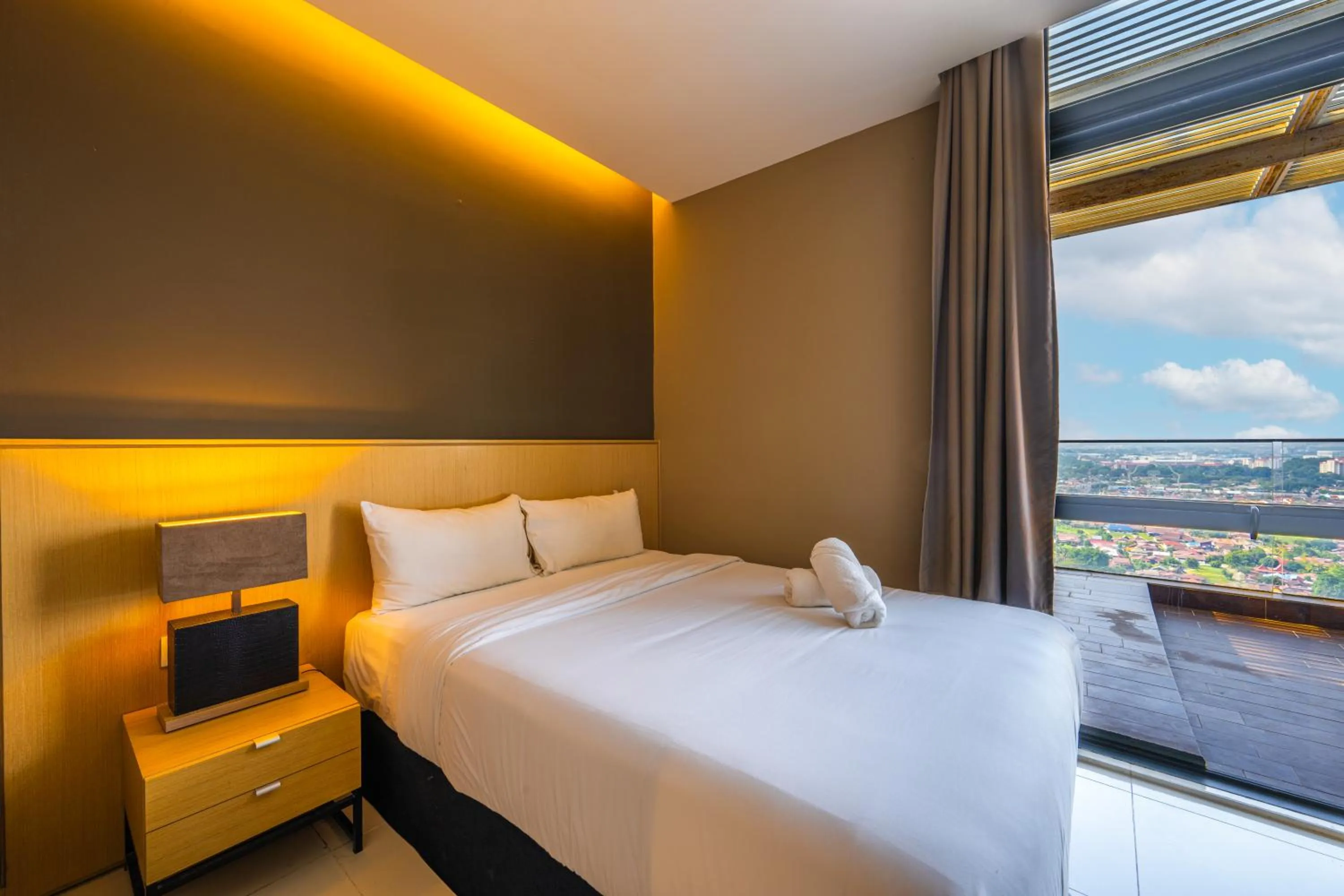 Bed in Greystone 99 Suites