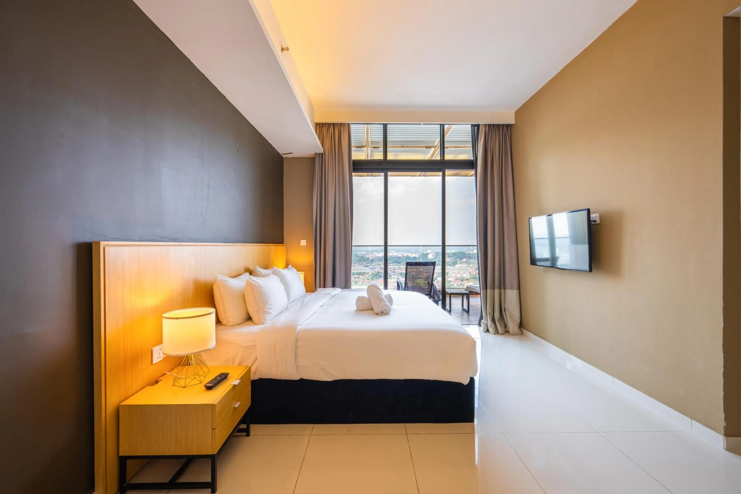 Bed in Greystone 99 Suites