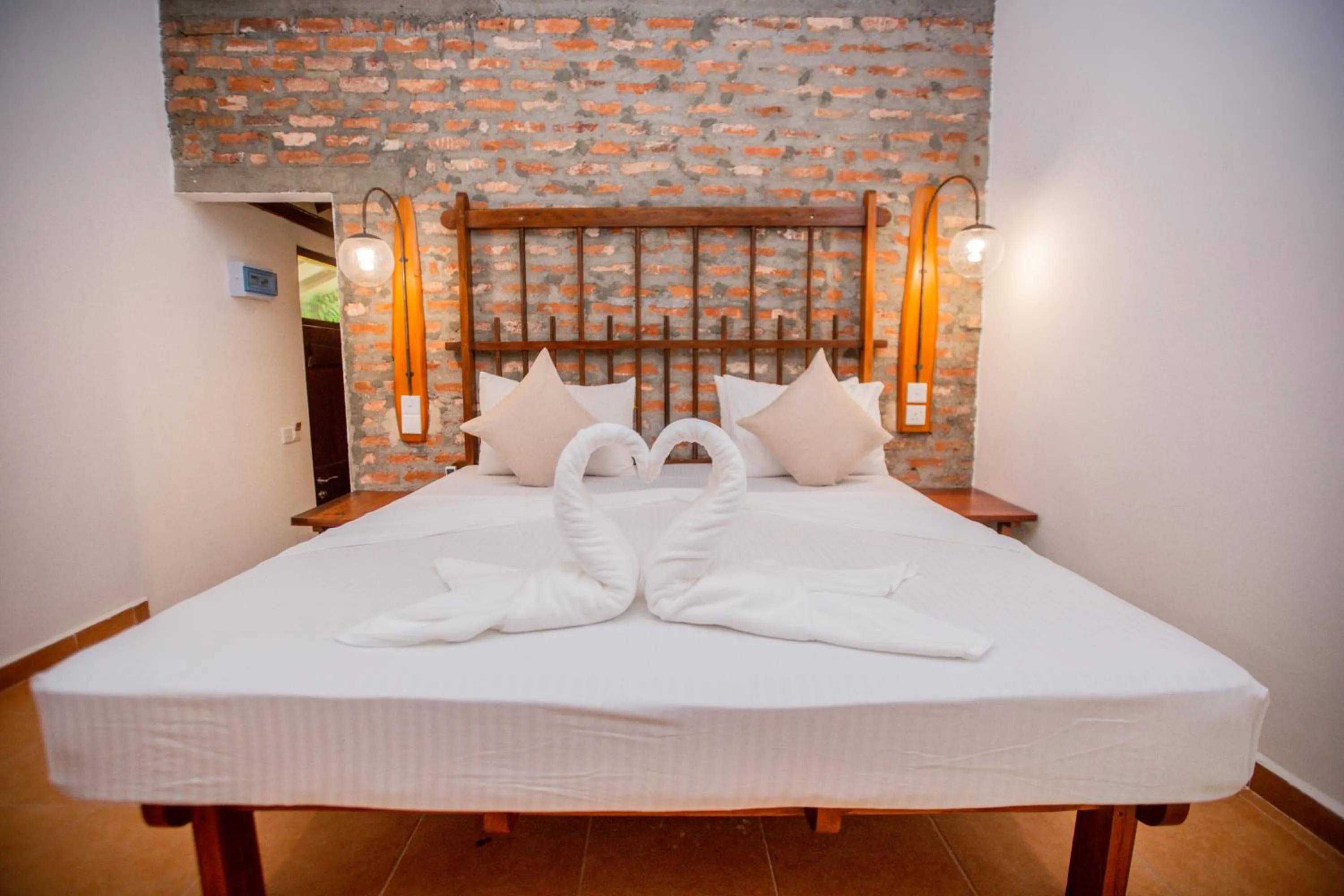 Bed in The Coastal Village Cabanas